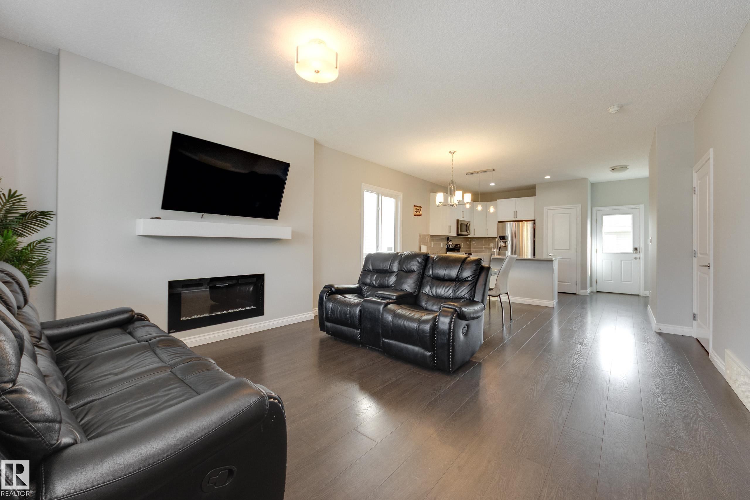 6687 Cardinal Road, Edmonton, AB - Indoor Photo Showing Living Room With Fireplace