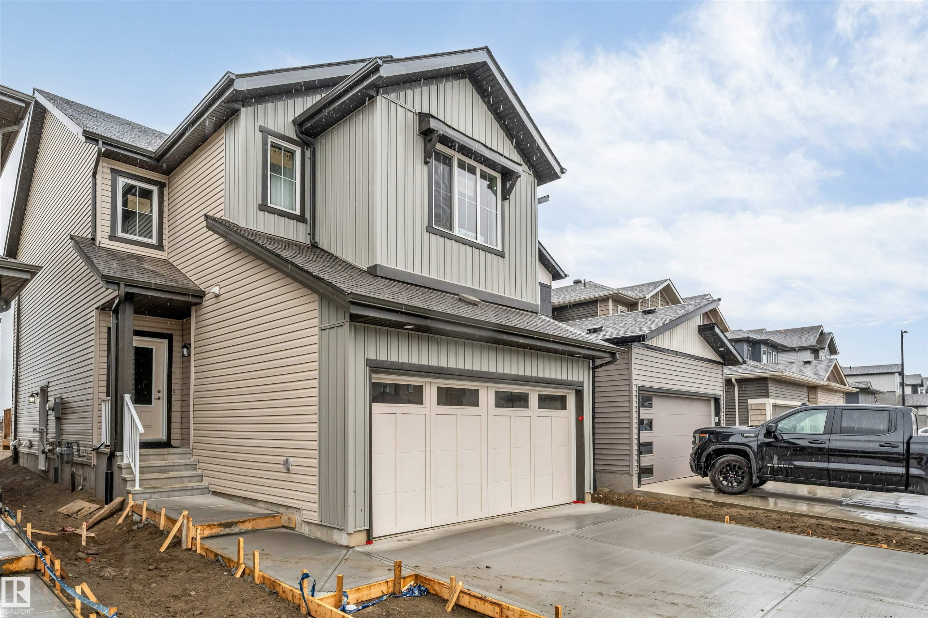 Two-story residence featuring light gray and beige siding - 1972 210 Street, Edmonton, AB - Outdoor