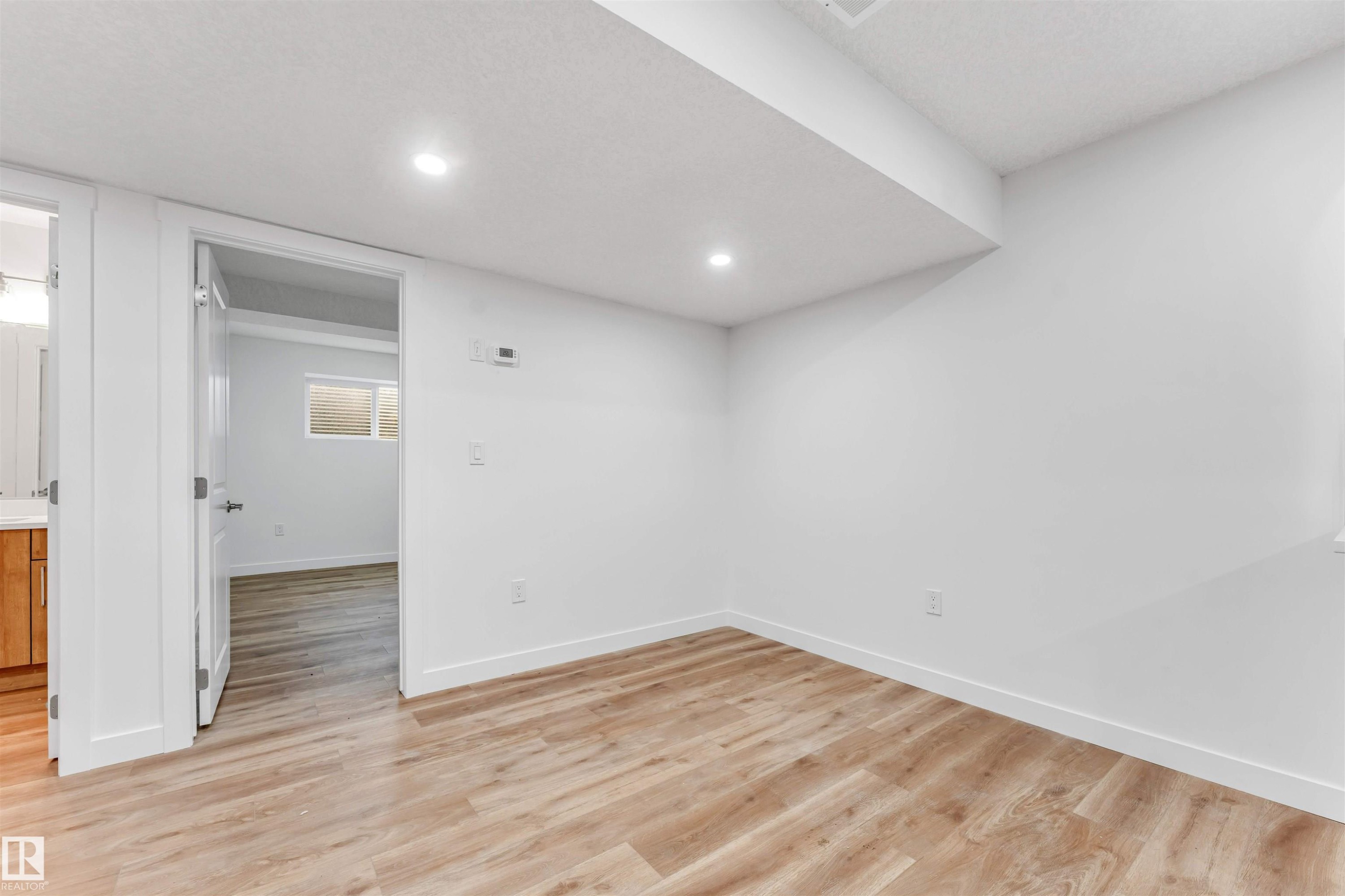 Room featuring wood-finish flooring and recessed ceiling lighting - 1972 210 Street, Edmonton, AB - Indoor Photo Showing Other Room