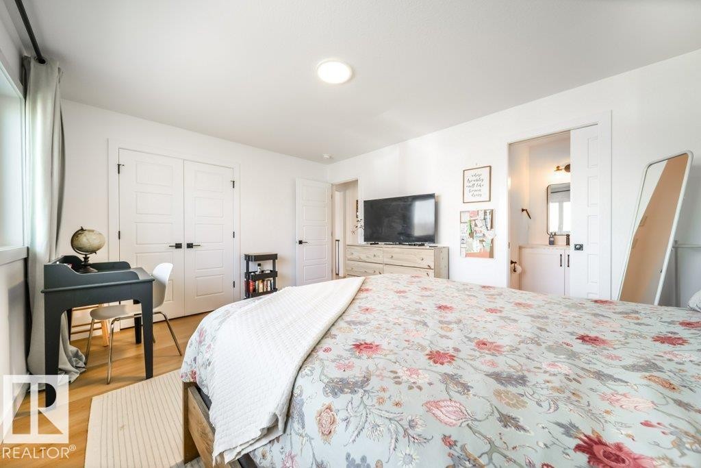 Bright room featuring wood-finish flooring and white walls - 11303 111 Avenue, Edmonton, AB - Indoor Photo Showing Bedroom