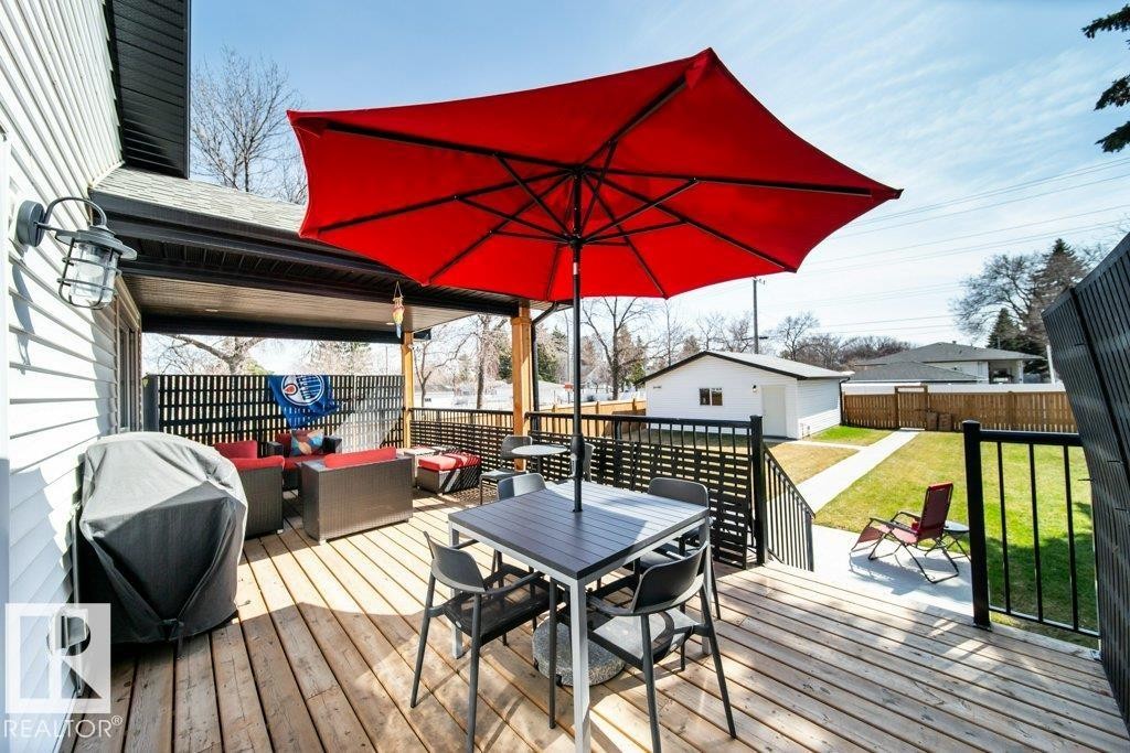 Spacious wood deck with black railing system - 11303 111 Avenue, Edmonton, AB - Outdoor With Deck Patio Veranda With Exterior