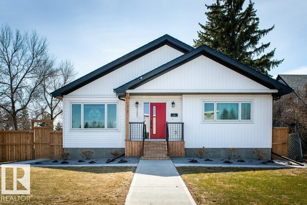 Crisp white siding exterior with a contrasting black roofline - 11303 111 Avenue, Edmonton, AB - Outdoor