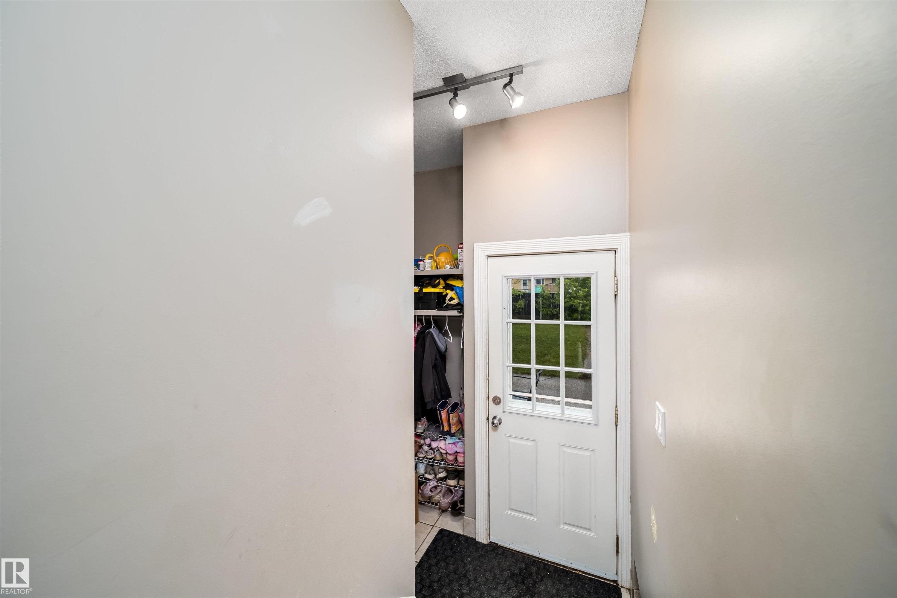White paneled door with windowpanes - 8512 142A Avenue, Edmonton, AB