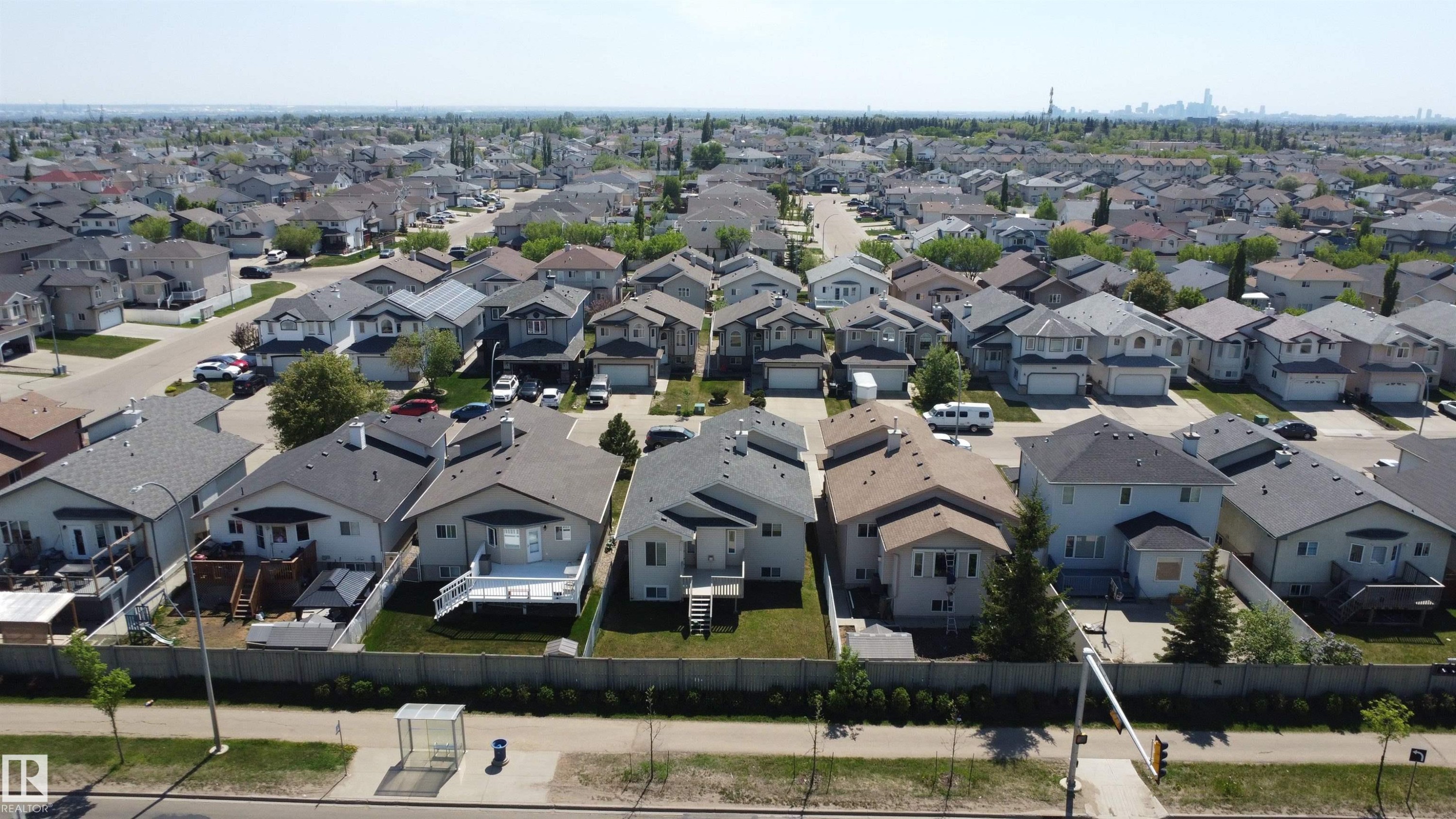 Aerial perspective showcasing a residential area with single-family homes, each featuring individual yards and varying architectural styles - 6144 166 Avenue, Edmonton, AB