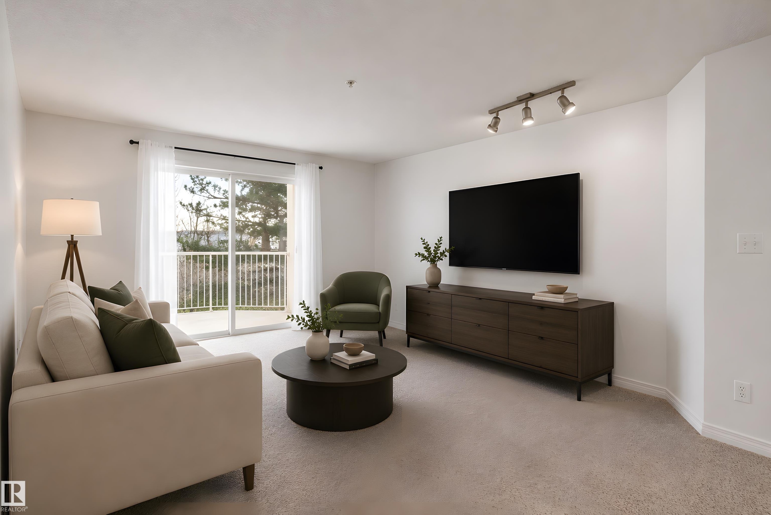 Living area with light-toned carpeting and white walls - 320 245 Edwards Drive, Edmonton, AB