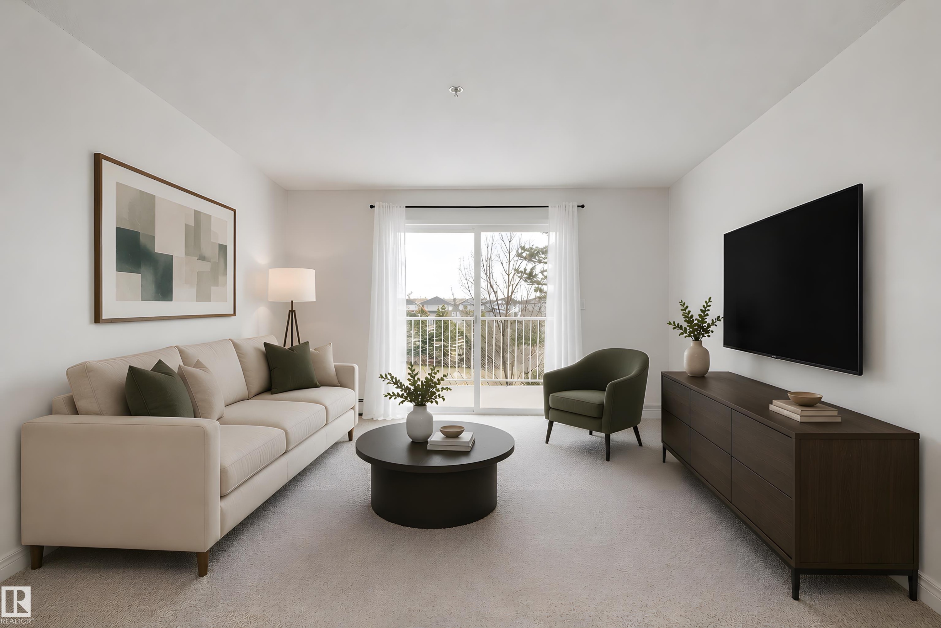 Bright living area featuring light-colored carpeting and white walls - 320 245 Edwards Drive, Edmonton, AB