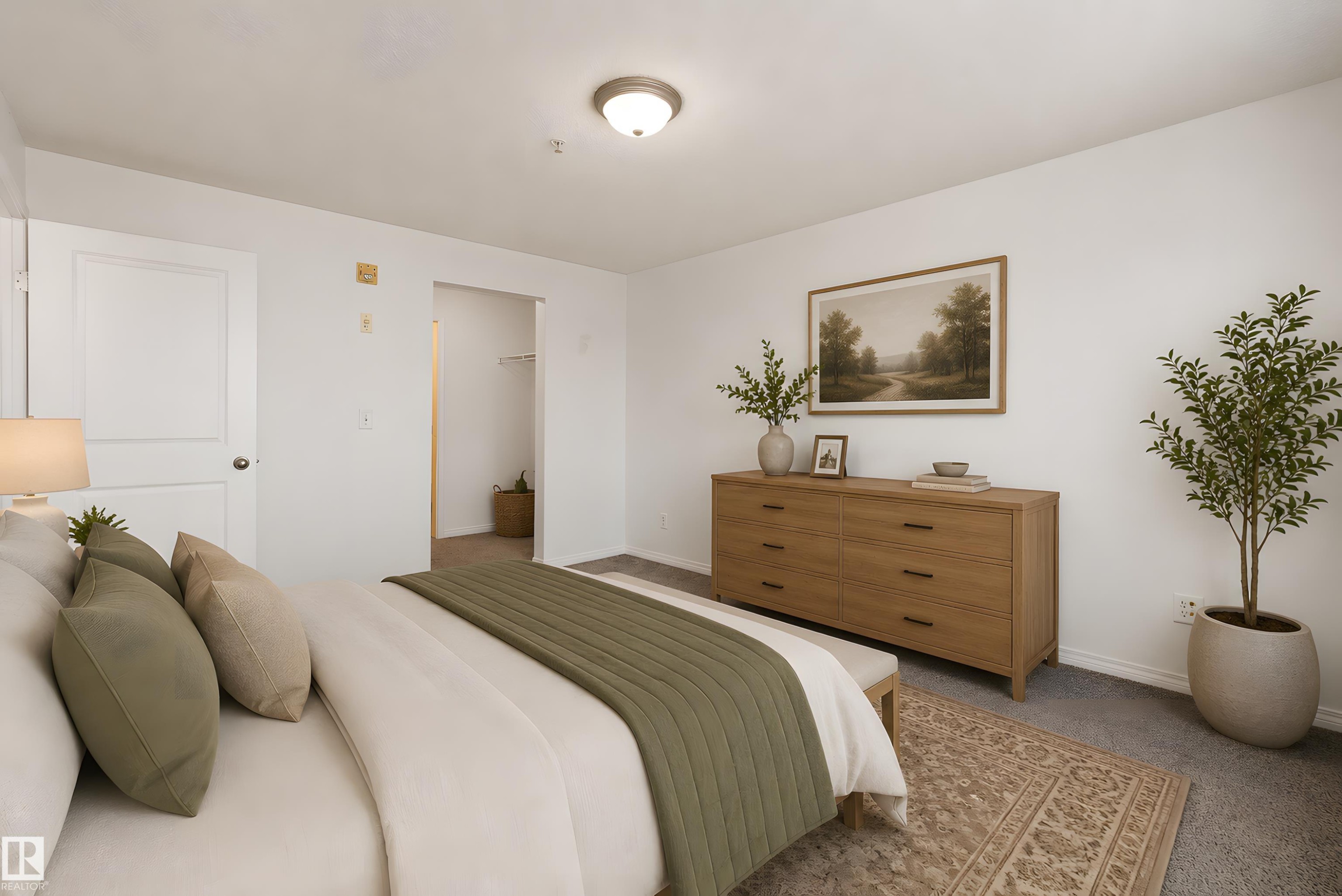 Spacious bedroom featuring neutral wall tones and plush carpeting - 320 245 Edwards Drive, Edmonton, AB