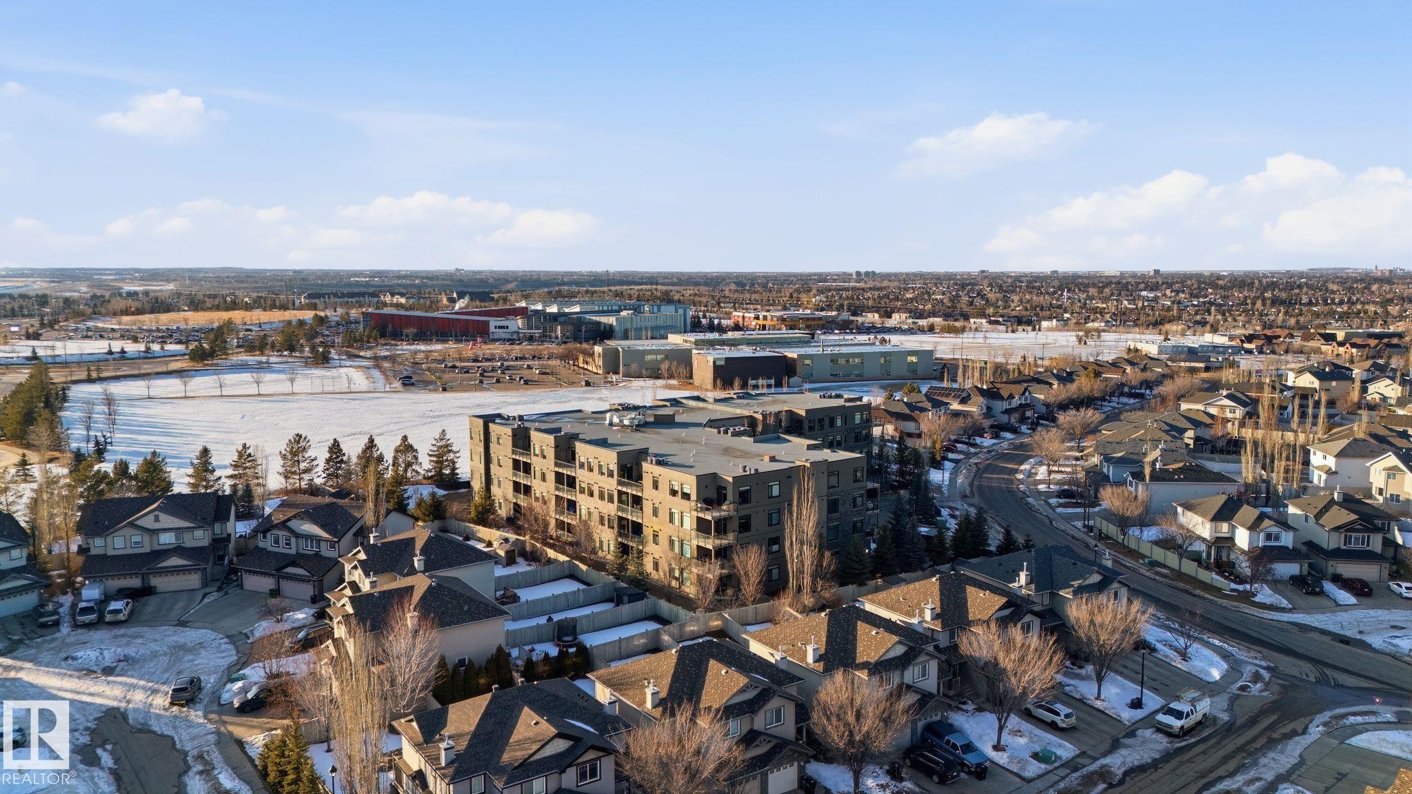 Contemporary multi-story building featuring multiple balconies and a flat roofline - 309 625 Leger Way, Edmonton, AB
