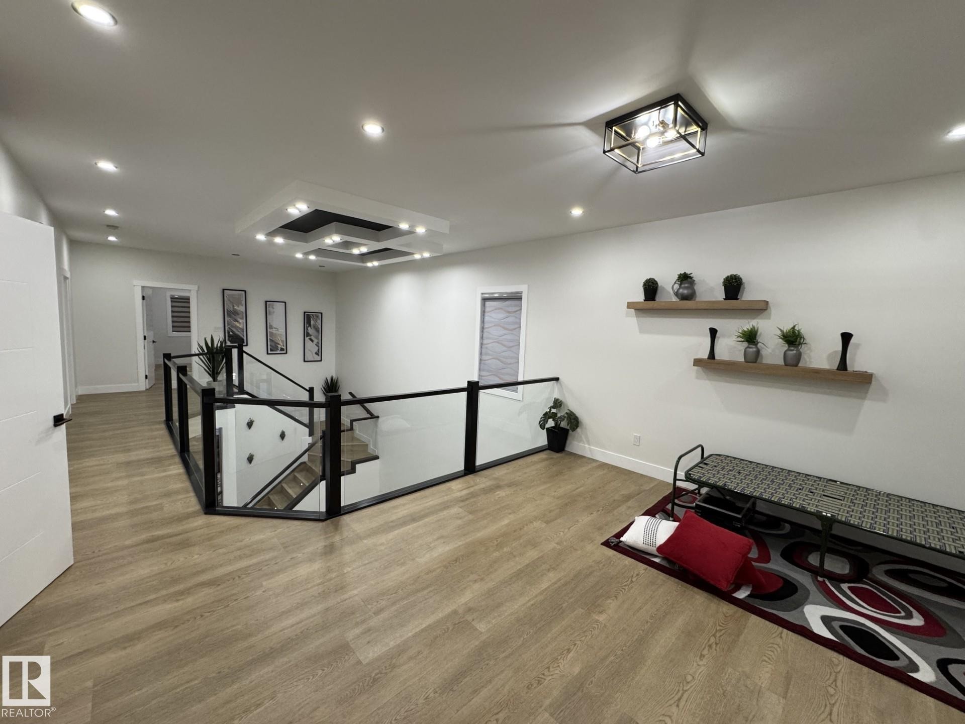 Spacious upper-level landing with light wood-finish flooring - 2123 18 Avenue, Edmonton, AB