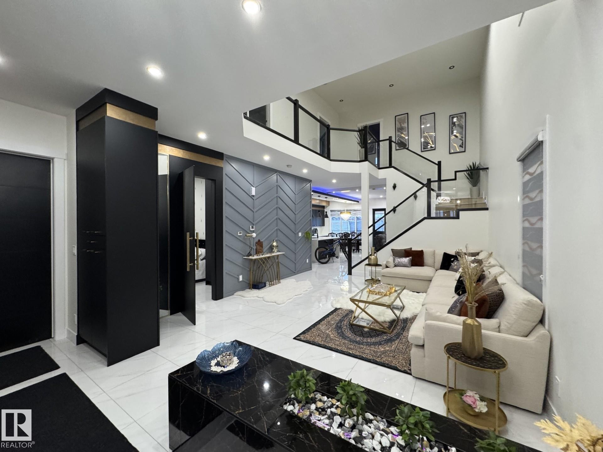 Grand foyer with high ceilings and white marble-look tile flooring - 2123 18 Avenue, Edmonton, AB