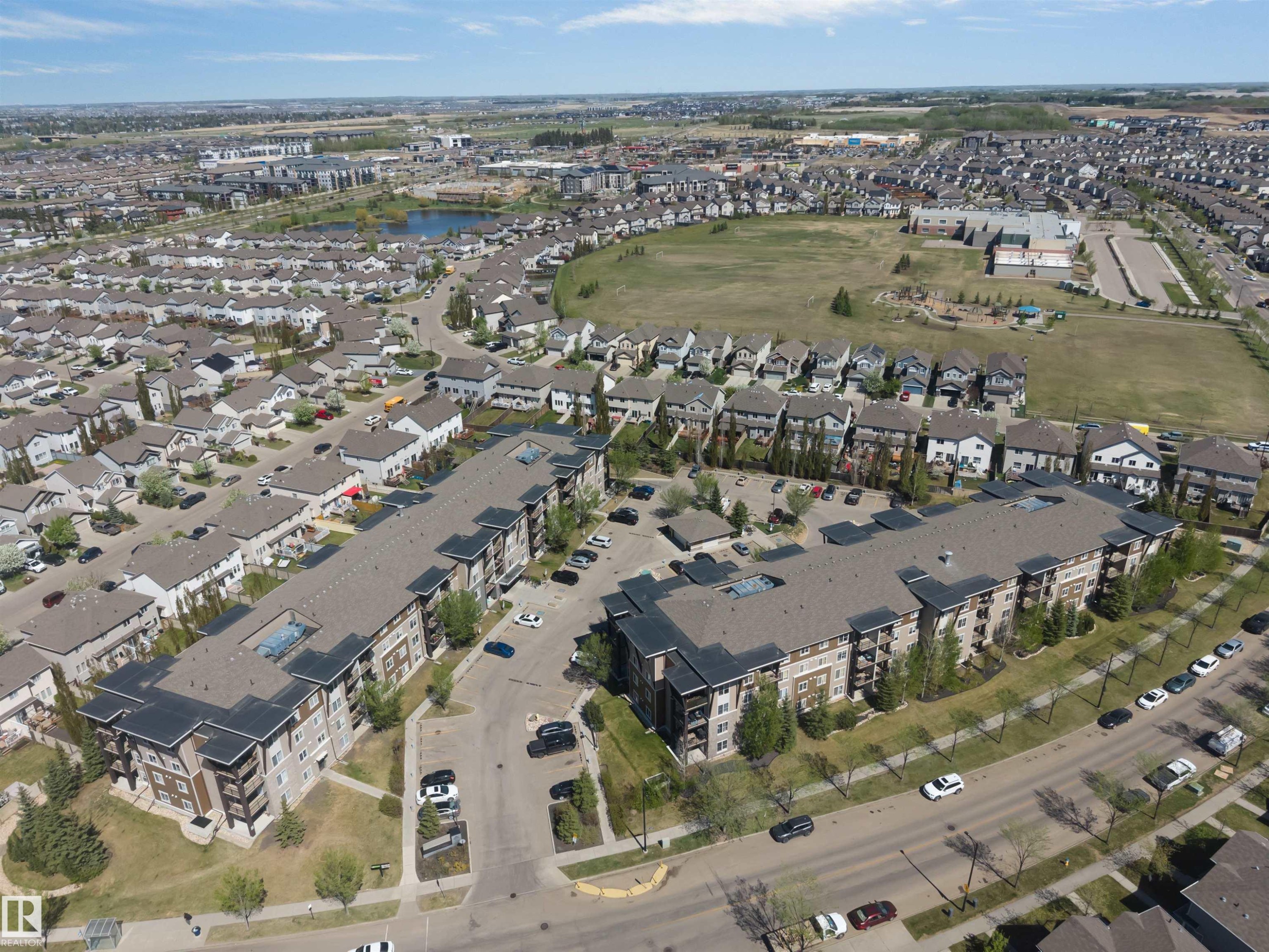 Contemporary multi-story apartment buildings featuring balconies and surface parking - 320 534 Watt Boulevard, Edmonton, AB - Outdoor With View