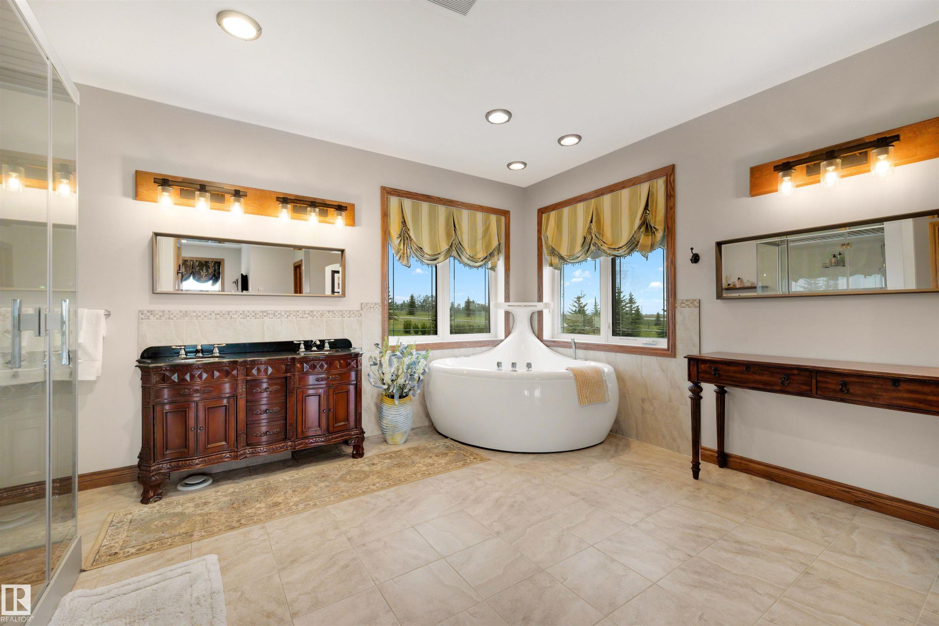 Soaking tub with integrated jets positioned beneath dual windows - 28125 Highway 587, Rural Red Deer County, AB - Indoor Photo Showing Other Room