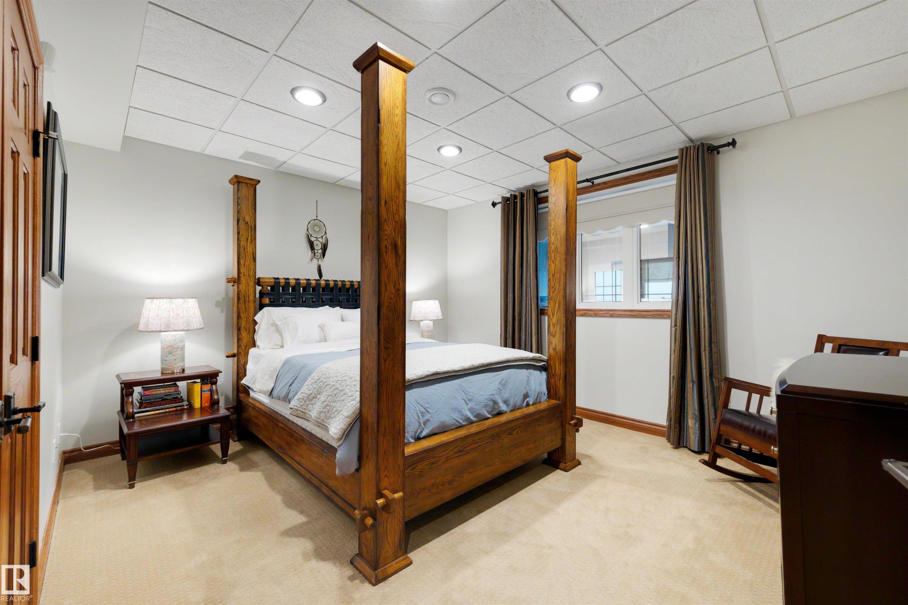 Carpeted room with recessed lighting and a window featuring dark wood trim and drapery - 28125 Highway 587, Rural Red Deer County, AB - Indoor Photo Showing Bedroom