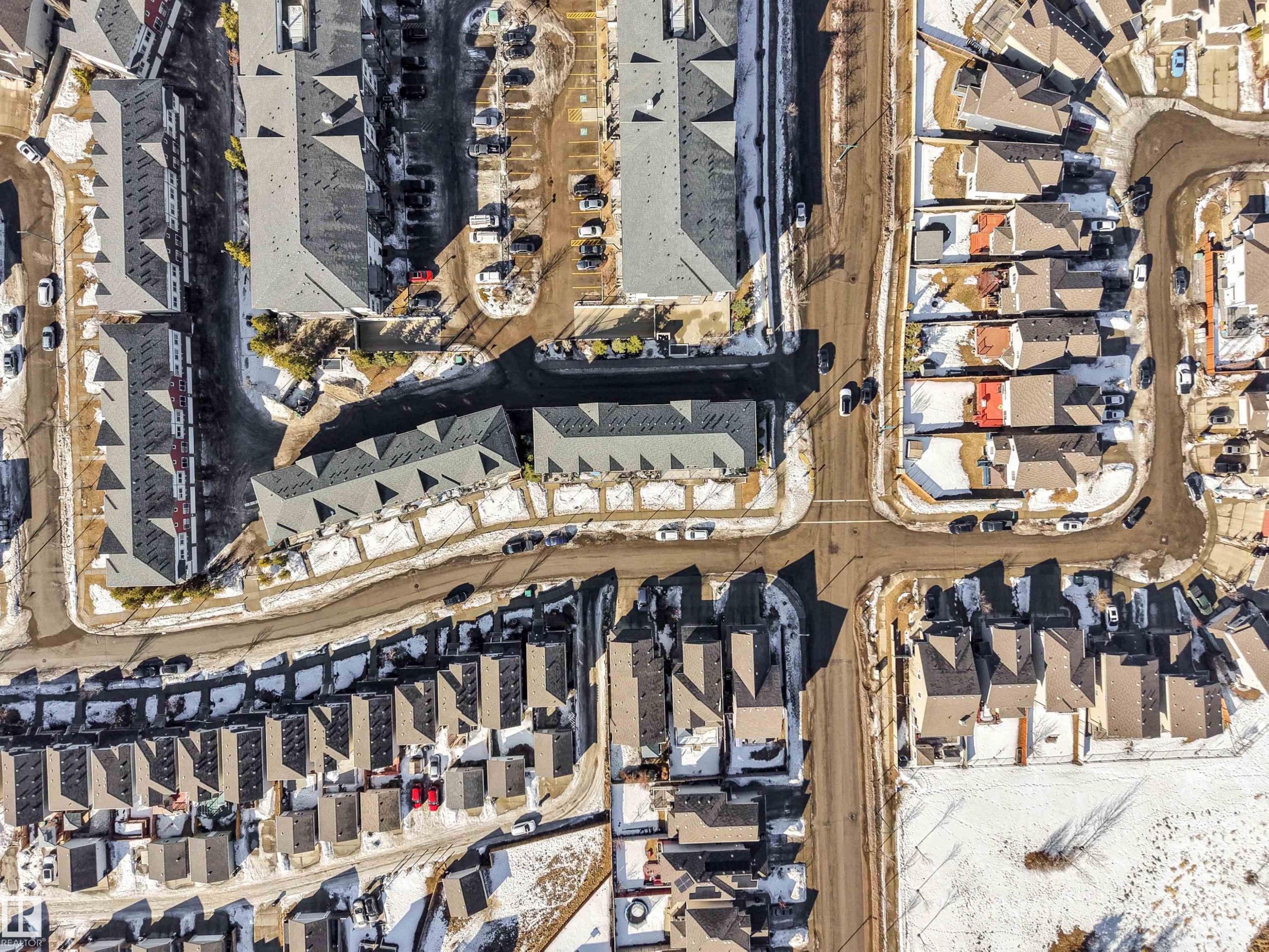 Aerial perspective showcasing a residential community with varied housing styles - 1624 33A Street, Edmonton, AB