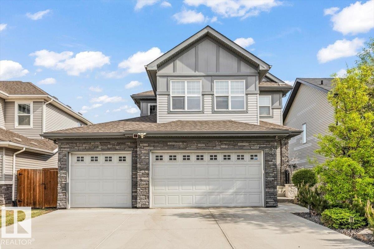 Triple Garage | Heated | Insulated | Workshop | Built-In Storage | Drain & Sink w/ hot & cold taps - 54 Spring Gate, Spruce Grove, AB