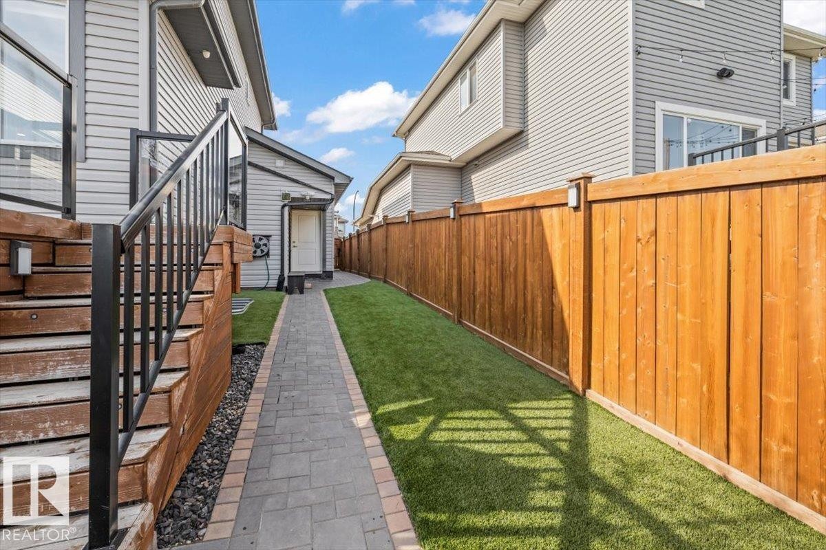 Designated dog run area, quality turf covering for low-maintenance landscaping - 54 Spring Gate, Spruce Grove, AB