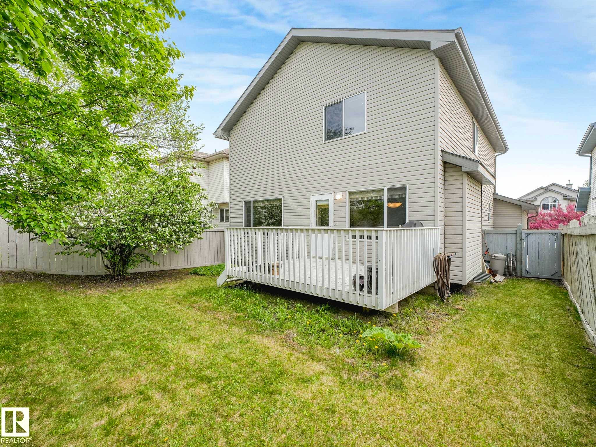 Rear exterior with a spacious wooden deck - 1116 Lincoln Crescent, Edmonton, AB - Outdoor