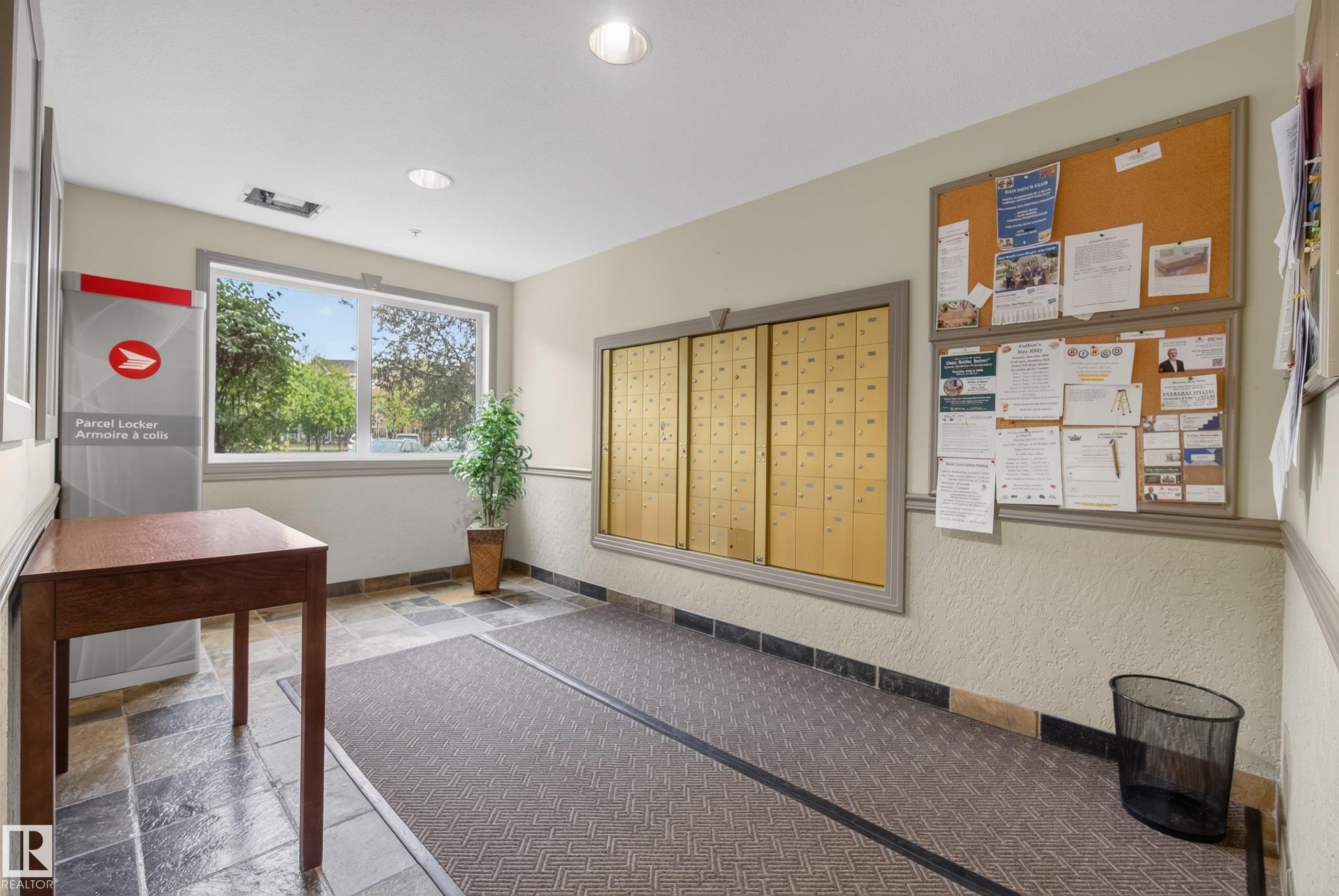 Entryway featuring a large window, slate-style flooring, and recessed lighting - 413 8912 156 Street Nw, Edmonton, AB