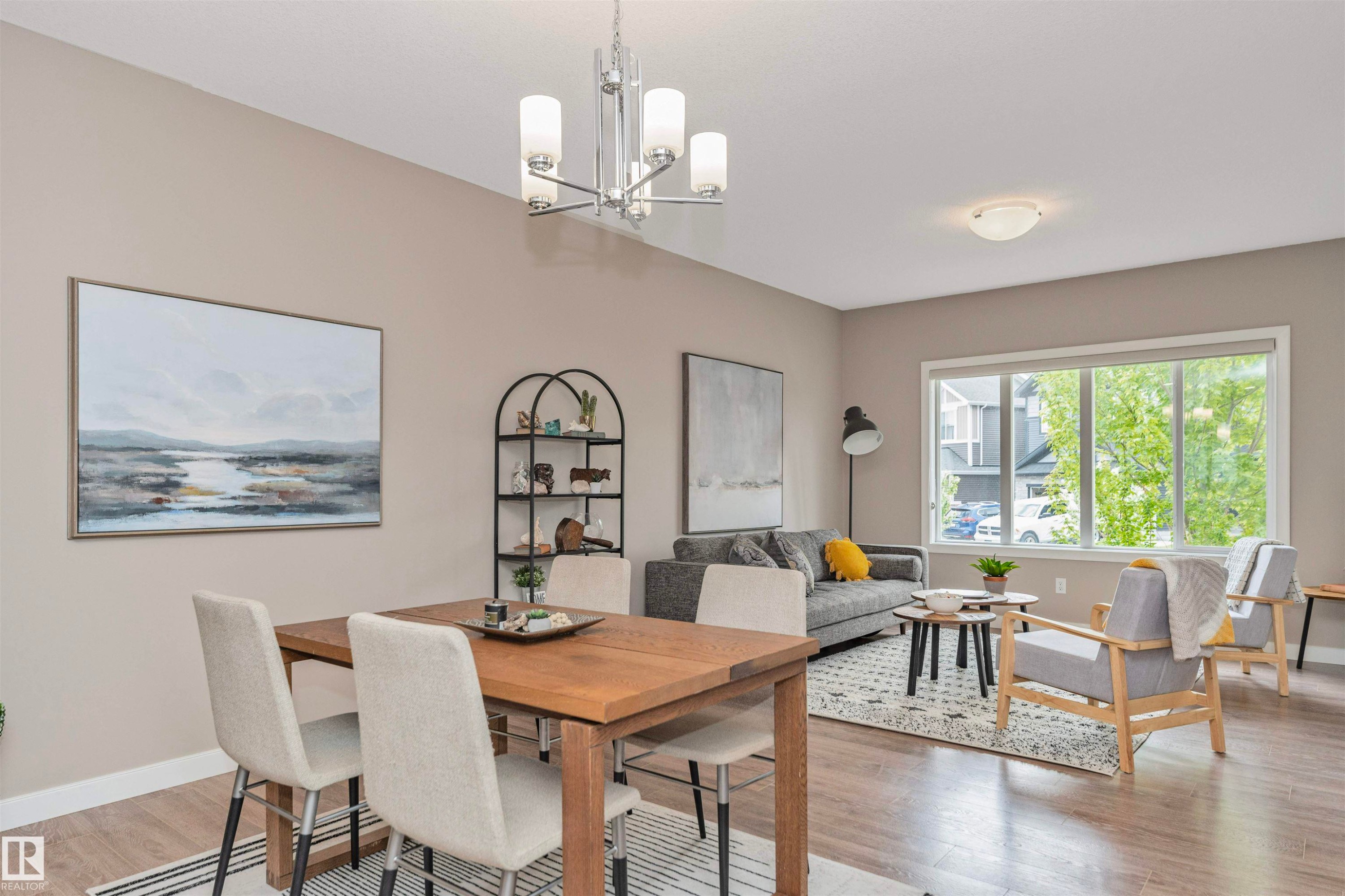 Open-concept living and dining area featuring wood-finish flooring and neutral wall tones - 22124 85 Avenue Nw, Edmonton, AB - Indoor