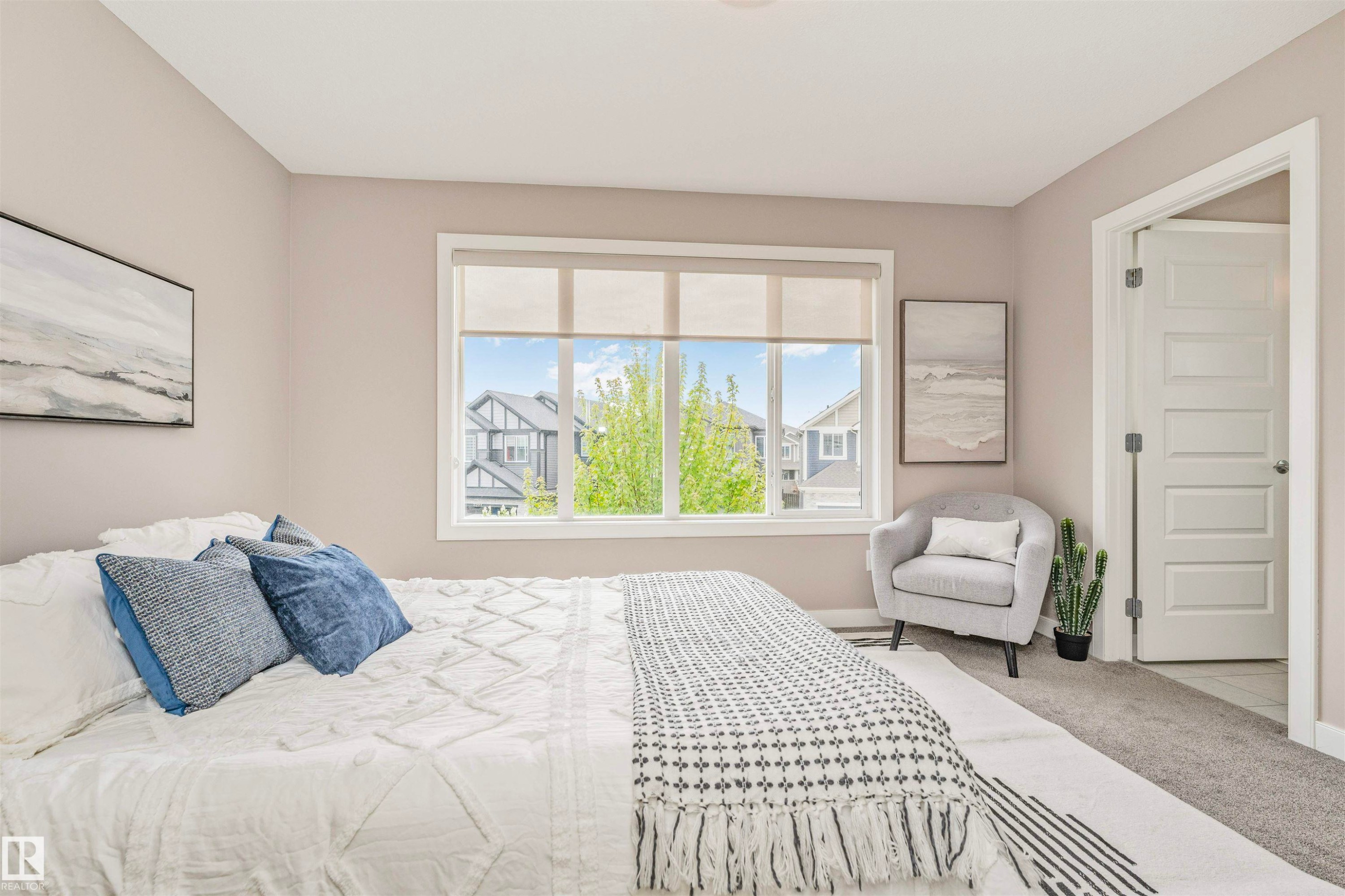Spacious bedroom with neutral wall tones and carpeted flooring - 22124 85 Avenue Nw, Edmonton, AB - Indoor Photo Showing Bedroom