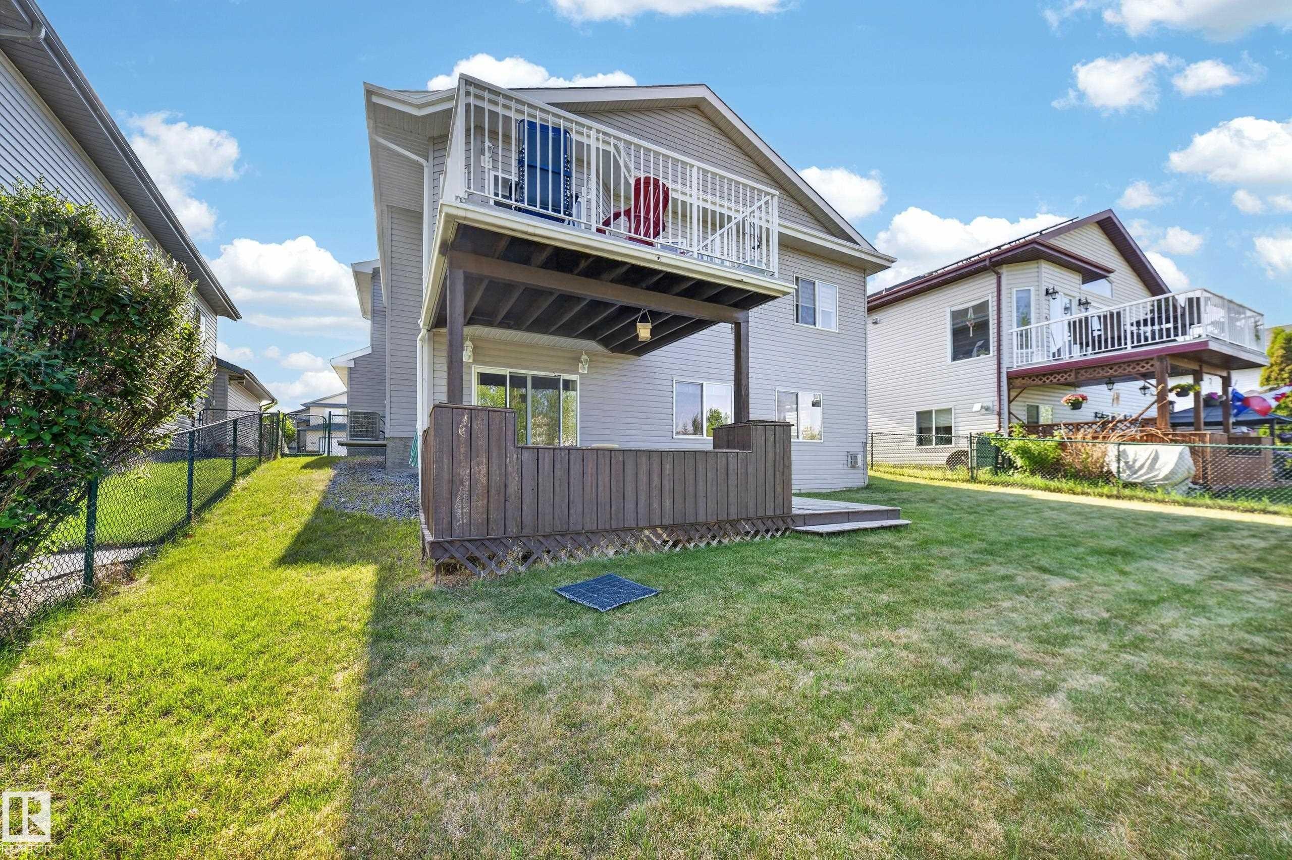 Rear exterior with dual-level outdoor spaces - 4113 59 Street, Beaumont, AB