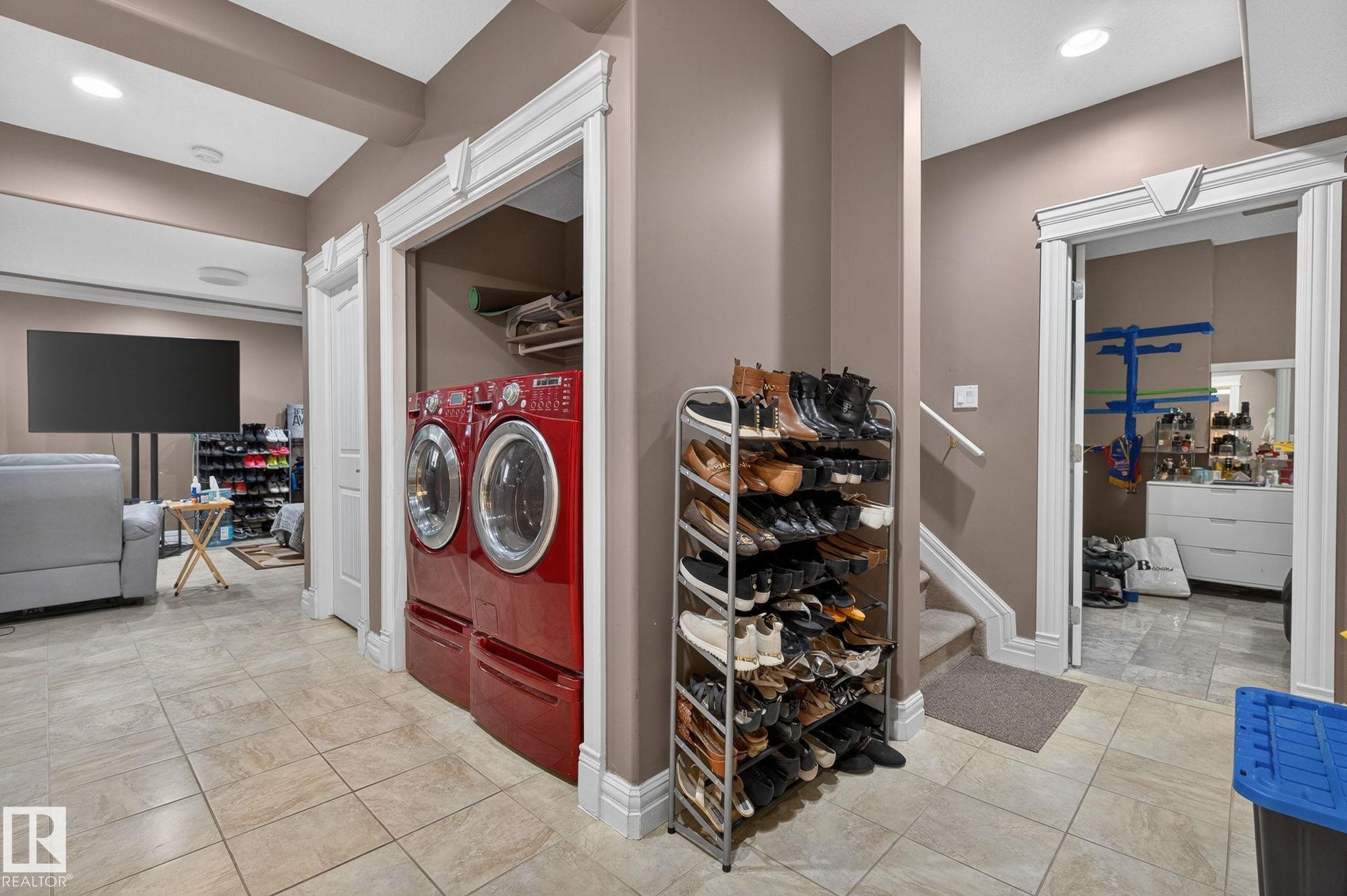Living area featuring a built-in entertainment center with a fireplace and integrated shelving, crown molding, and recessed lighting - 1508 Palmer Close, Edmonton, AB