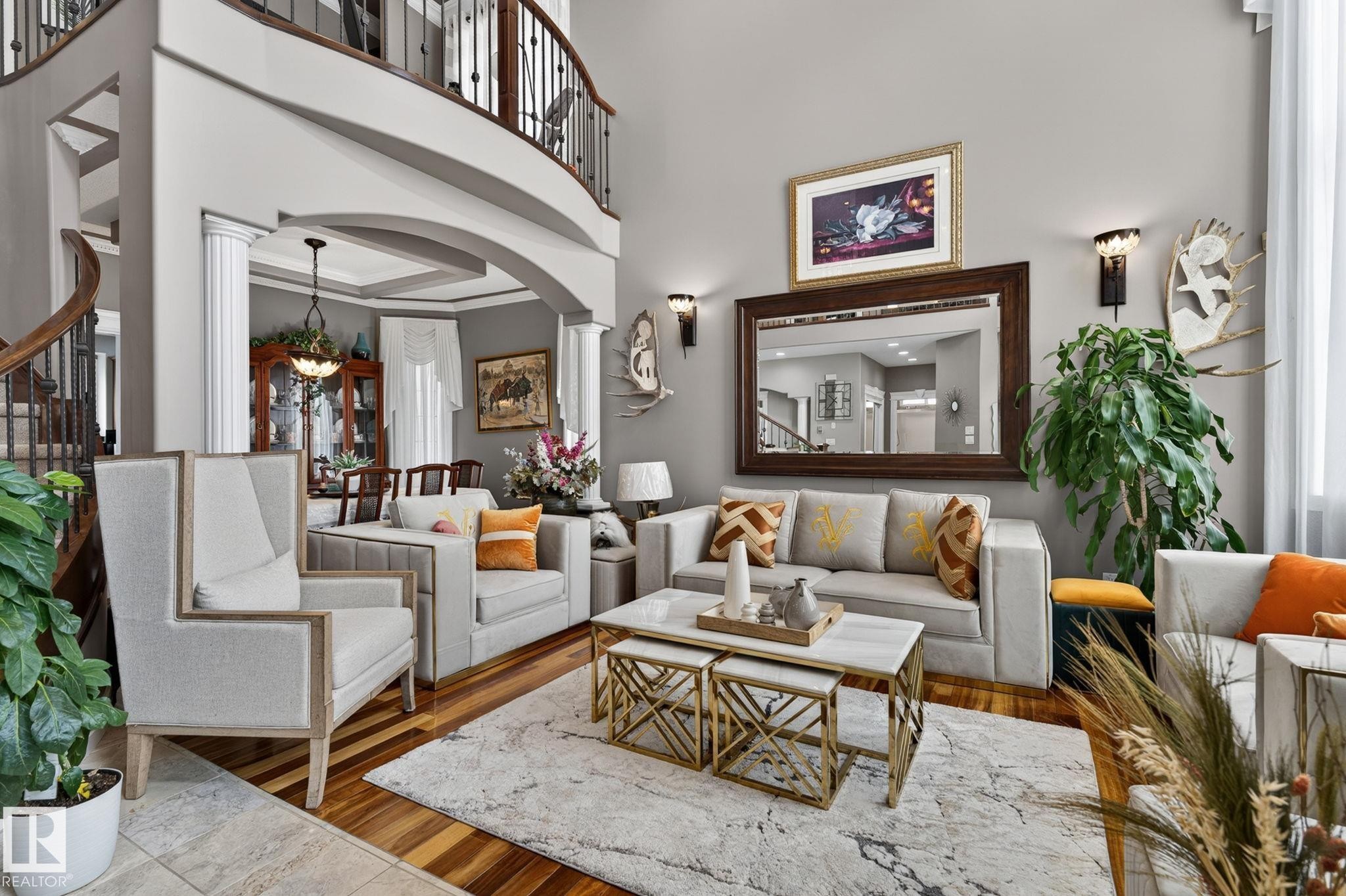 Brick exterior featuring an arched double entry door with decorative glass, a grand two-story window, stacked stone accents, and a concrete pathway with steps - 1508 Palmer Close, Edmonton, AB