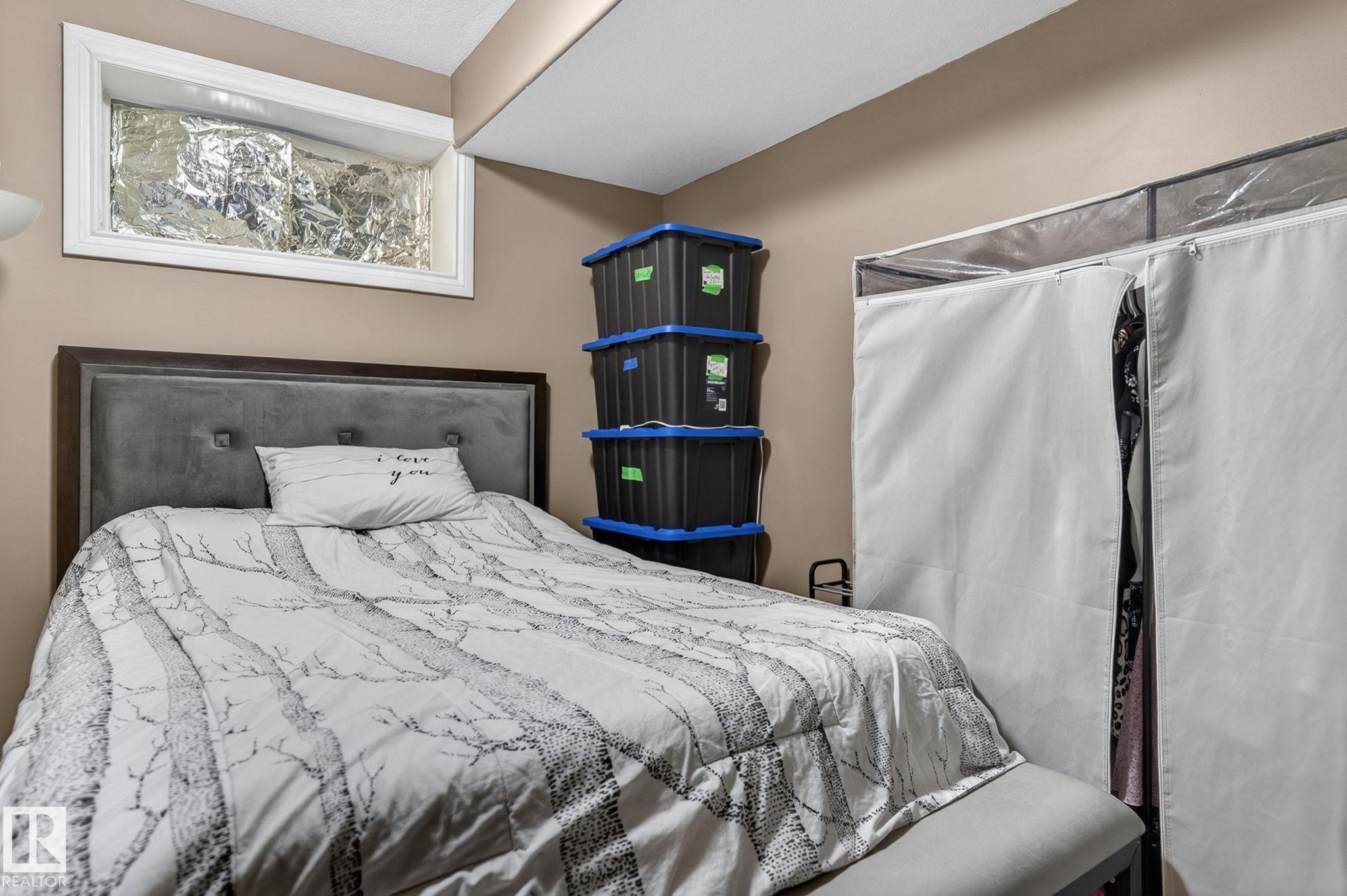 Bay window featuring vertical blinds and draped valances - 1508 Palmer Close, Edmonton, AB