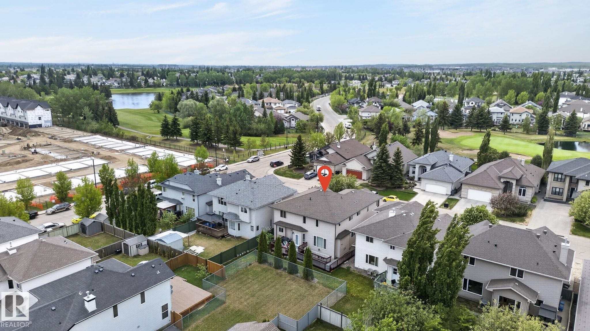 Dedicated laundry area featuring a stacked washer and dryer unit - 1508 Palmer Close, Edmonton, AB