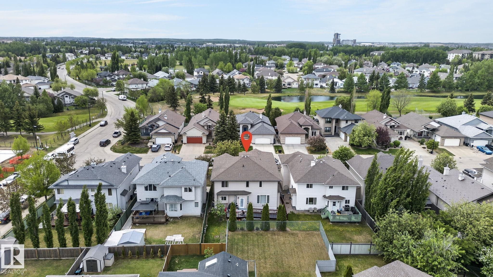 Recessed lighting illuminates this expansive space featuring tray ceilings and tile flooring - 1508 Palmer Close, Edmonton, AB