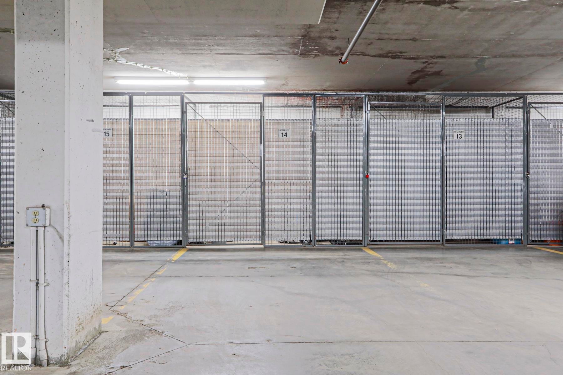 Dedicated storage cages with metal grate construction - 117 160 Magrath Road, Edmonton, AB - Indoor Photo Showing Garage