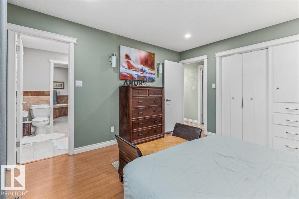 Interior room featuring light wood-finish flooring and a light green wall color - 6720 29 Avenue, Edmonton, AB