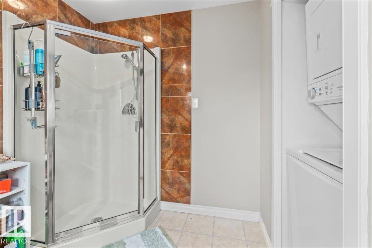 Glass-enclosed shower stall with a handheld shower fixture - 6720 29 Avenue, Edmonton, AB