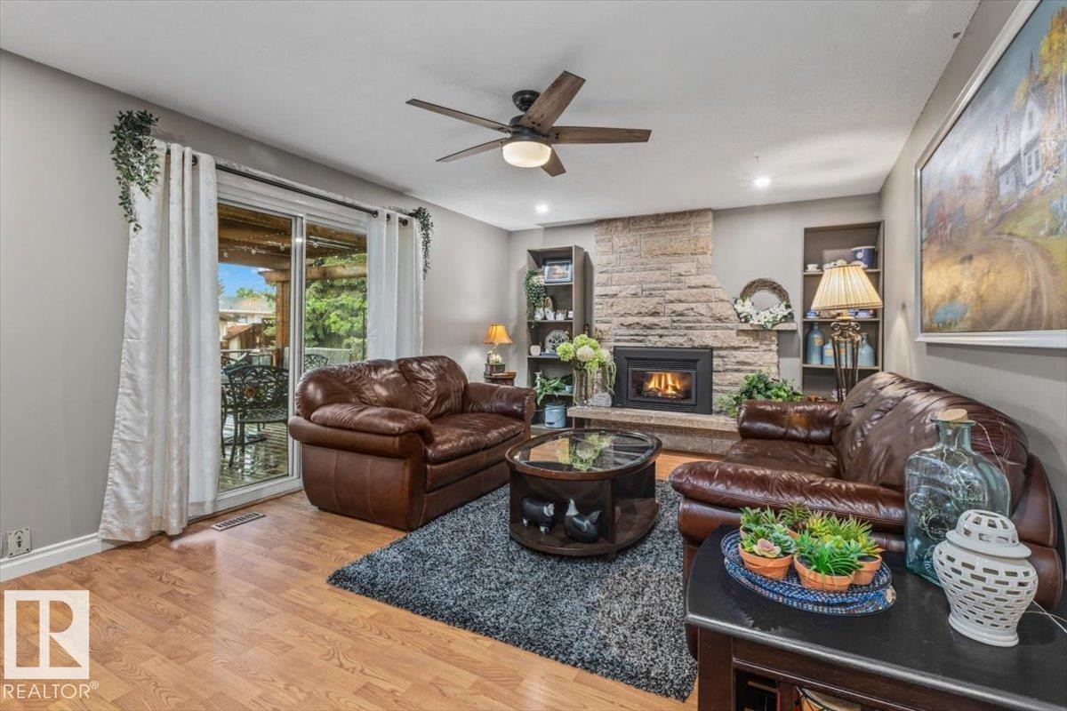 Living area featuring wood-finish flooring and recessed lighting - 6720 29 Avenue, Edmonton, AB