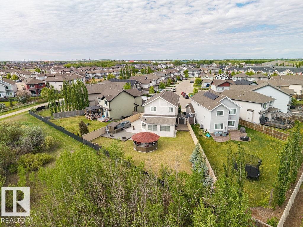 Expansive backyard featuring a gazebo, patio space, and mature trees - 13703 166 Avenue Nw, Edmonton, AB - Outdoor With View