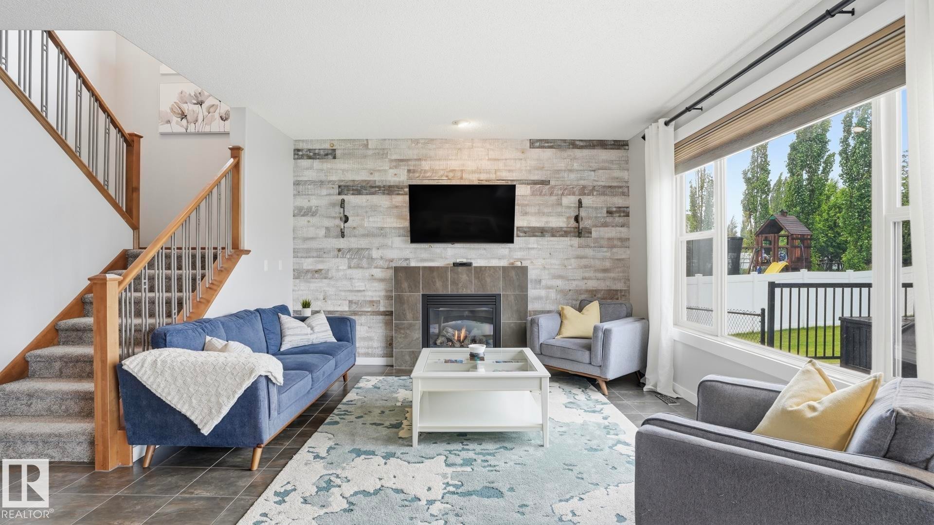 75 Rue Moreau, Beaumont, AB - Indoor Photo Showing Living Room With Fireplace