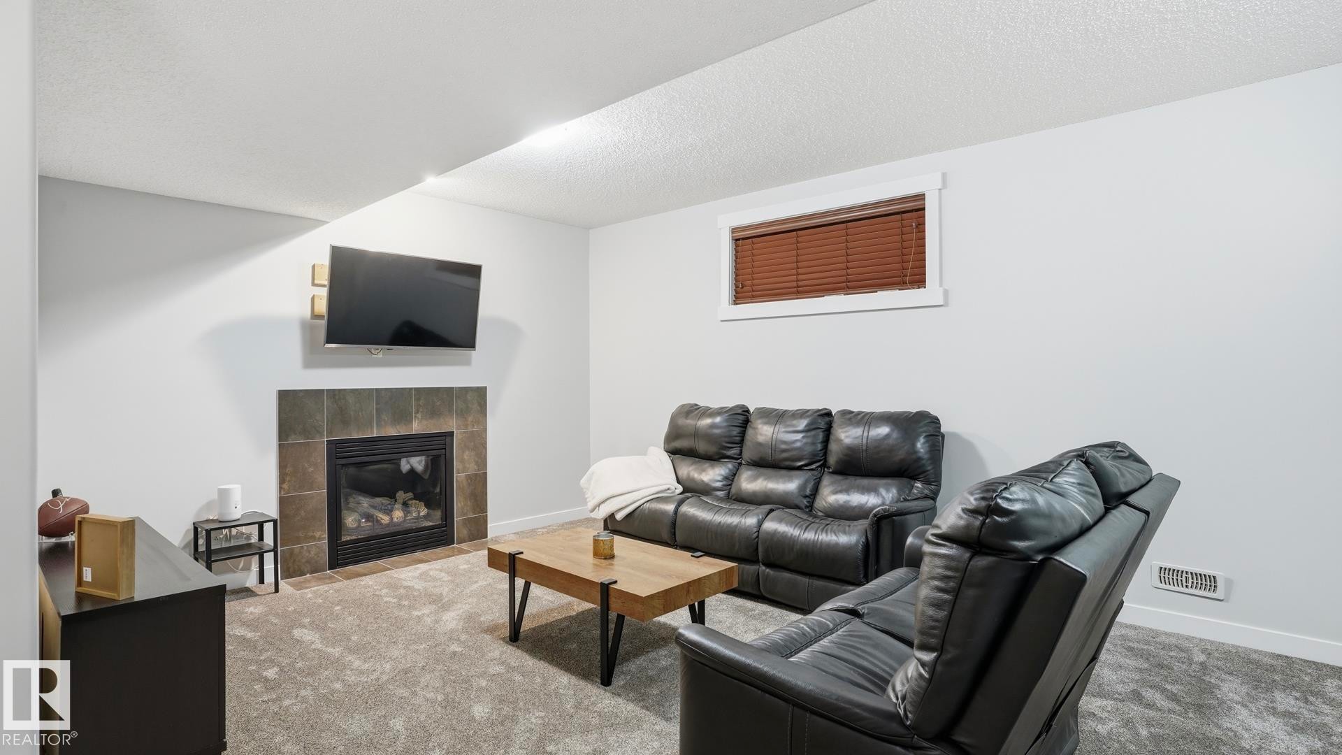 75 Rue Moreau, Beaumont, AB - Indoor Photo Showing Living Room With Fireplace