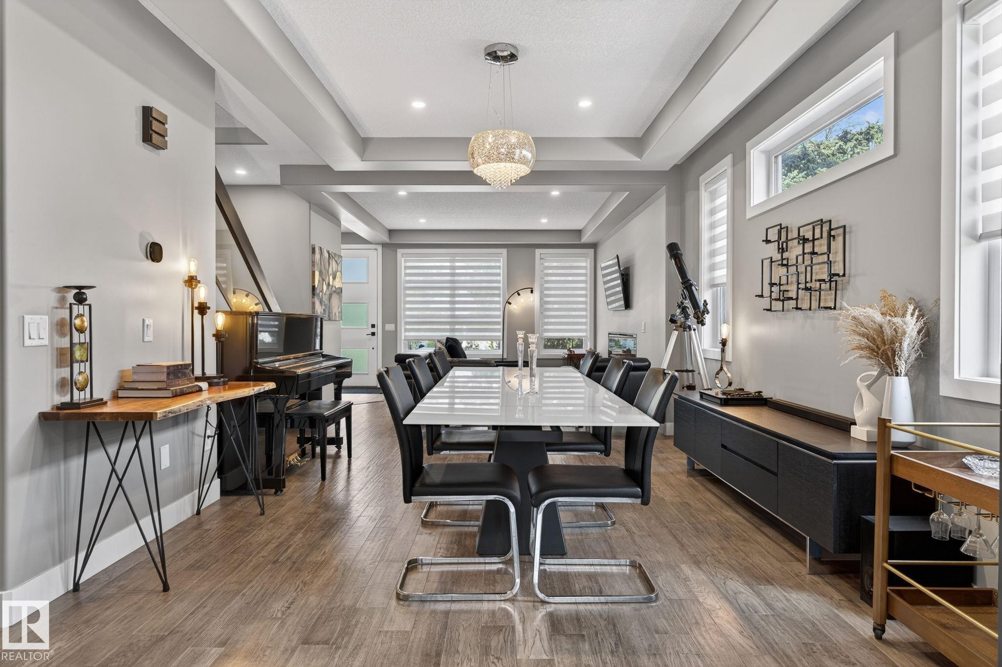 Open-concept living space featuring wood-finish flooring, recessed lighting, and a coffered ceiling - 8809 148 Street, Edmonton, AB - Indoor Photo Showing Dining Room
