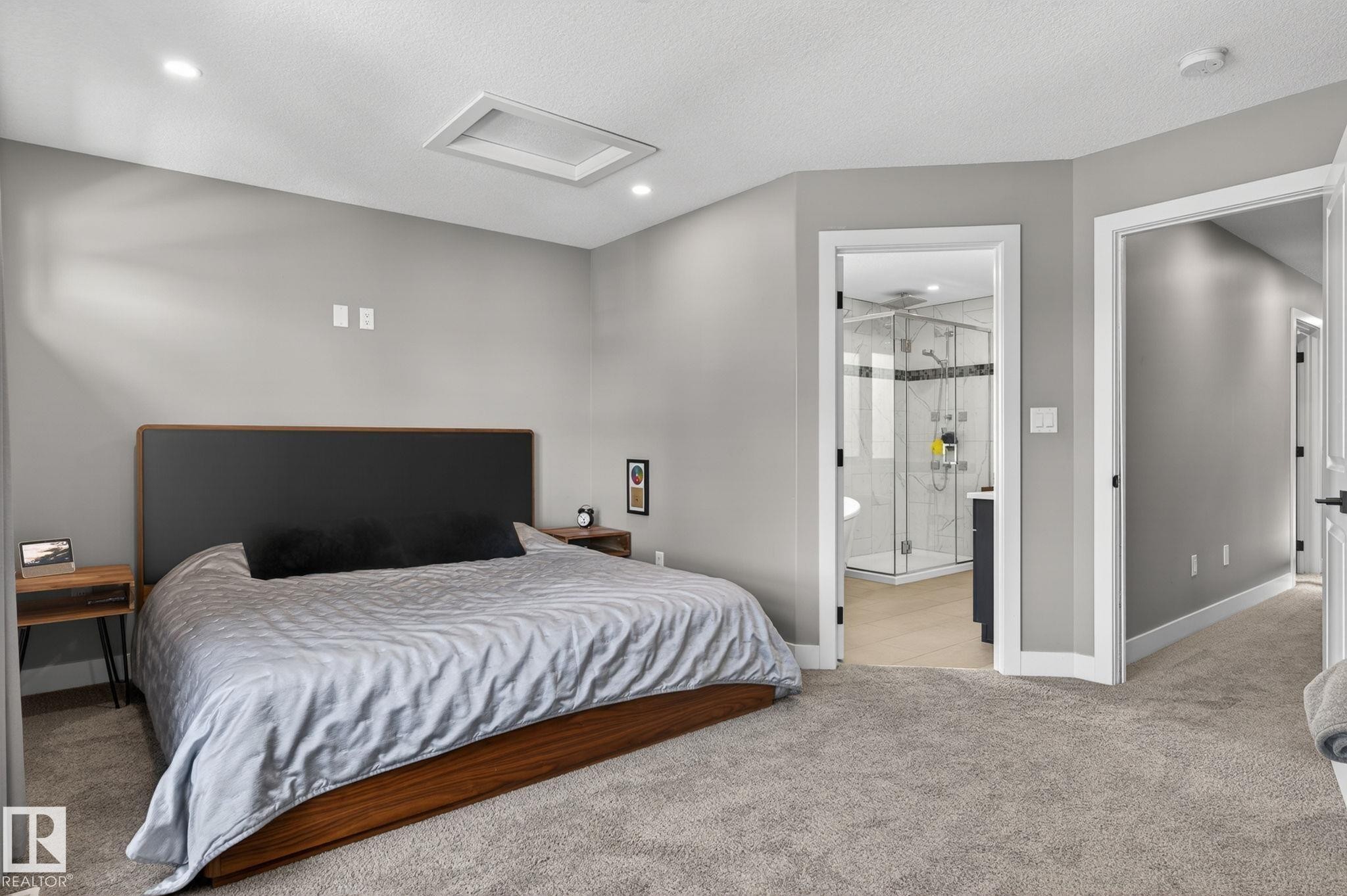 Carpeted bedroom with recessed lighting and a ceiling-mounted skylight - 8809 148 Street, Edmonton, AB - Indoor Photo Showing Bedroom