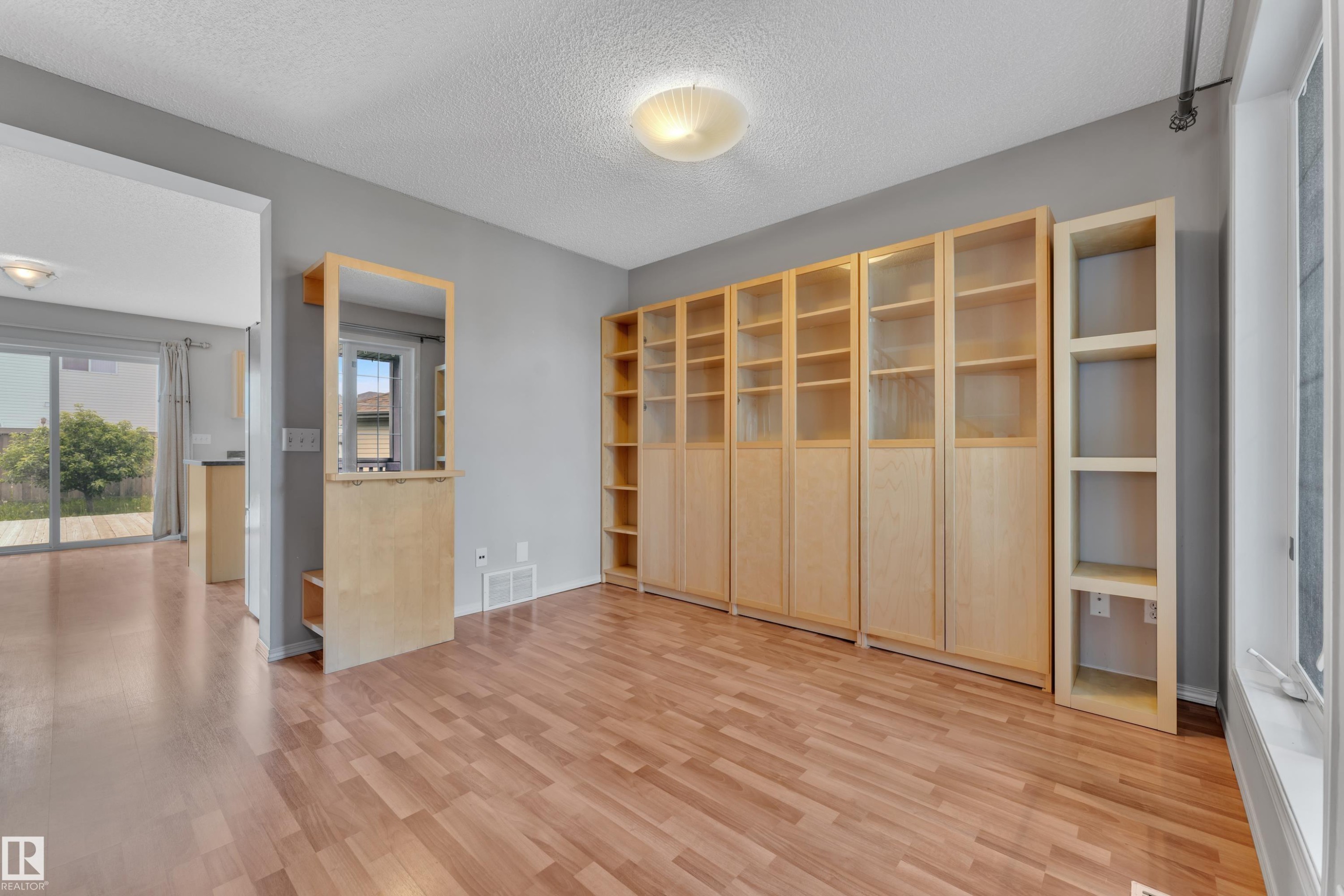 Interior room with wood-finish flooring and light gray painted walls - 14031 136 Street, Edmonton, AB