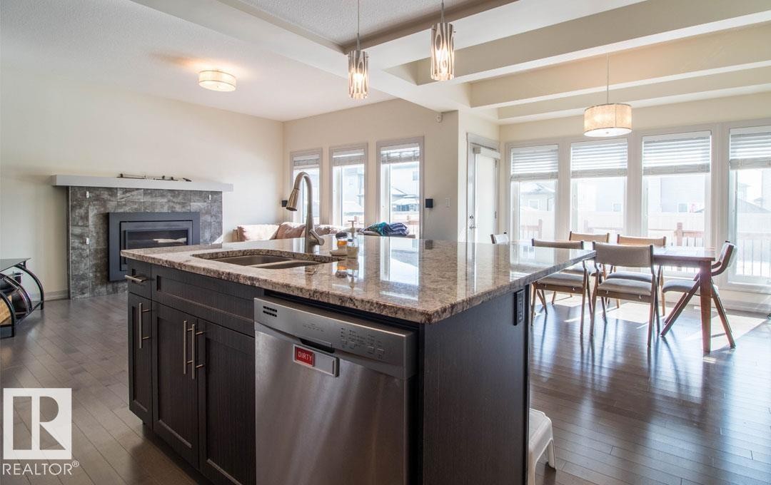 13855 143 Avenue Nw, Edmonton, AB - Indoor Photo Showing Kitchen With Fireplace With Double Sink