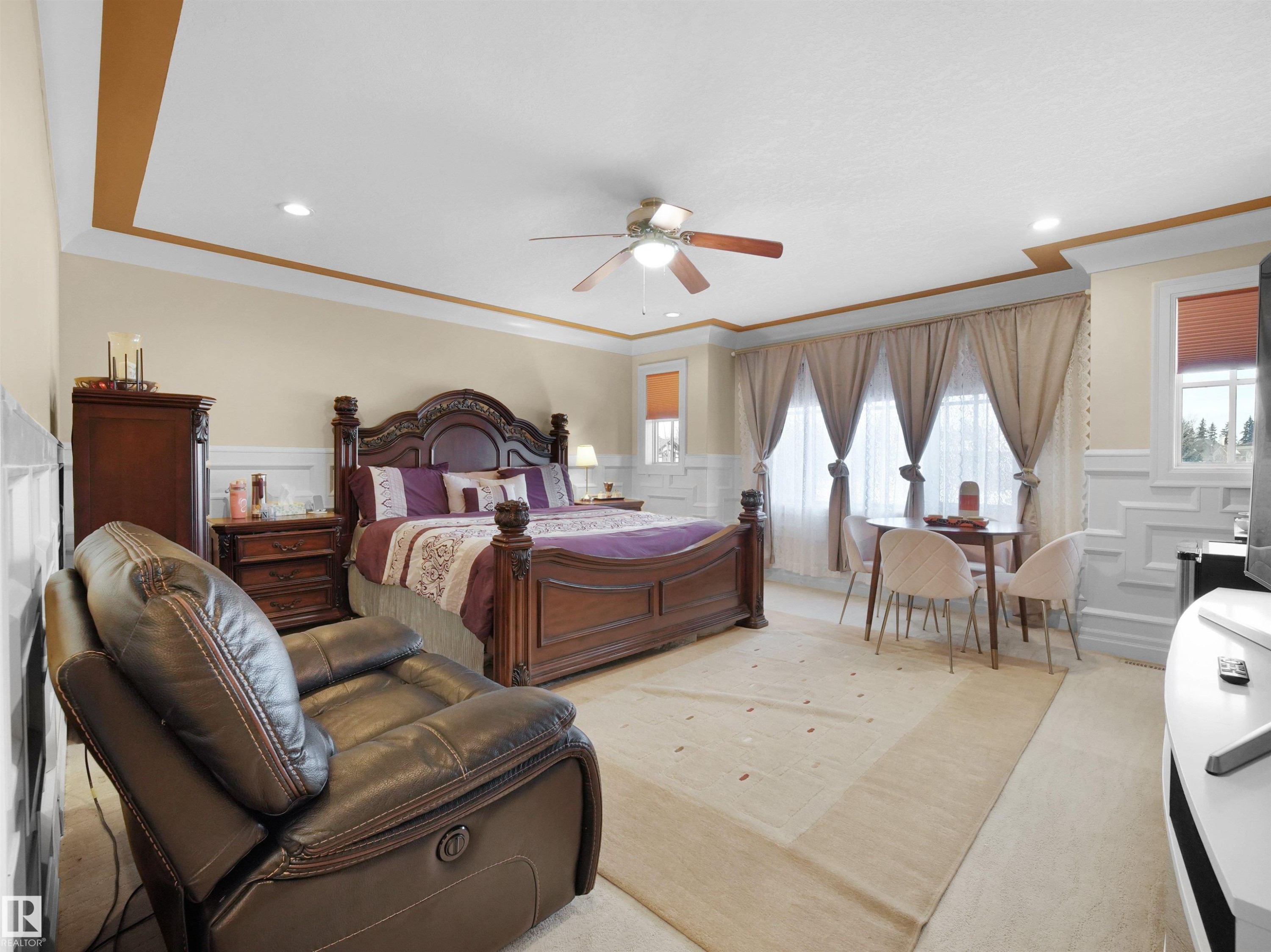 Bonus Room converted into bedroom, featuring crown molding, wainscoting, recessed lighting, a ceiling fan, and carpeted flooring - 2019 Cameron Ravine Way Nw, Edmonton, AB