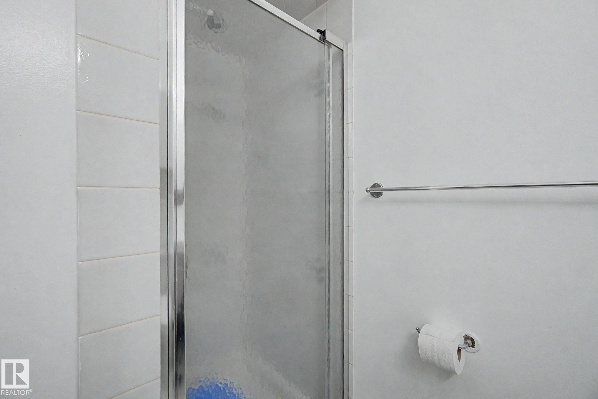 Shower enclosure with frosted glass panel and chrome frame - 242 Northmount Drive, Wetaskiwin, AB
