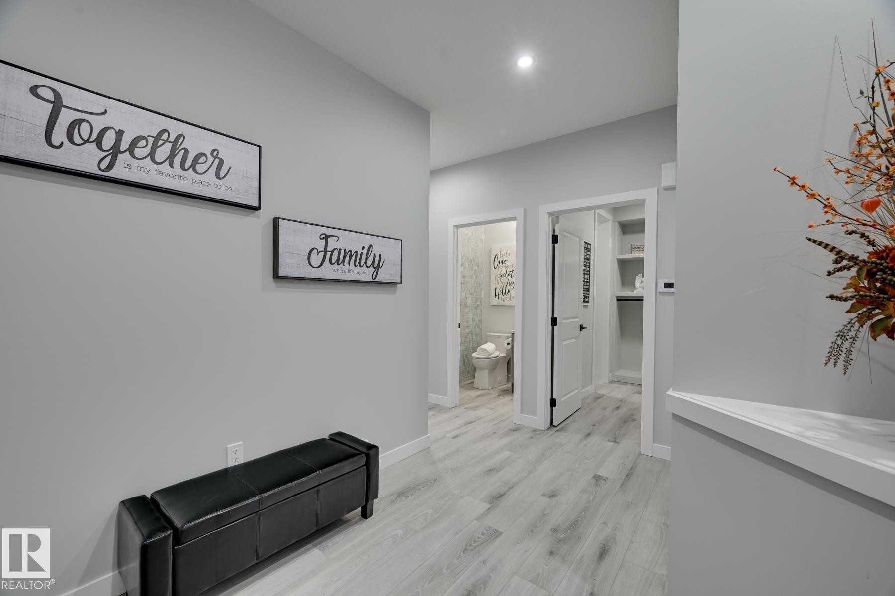Hallway featuring light wood-finish flooring, recessed lighting, and crisp white trim - 54 Chartres Close, St. Albert, AB - Indoor Photo Showing Other Room