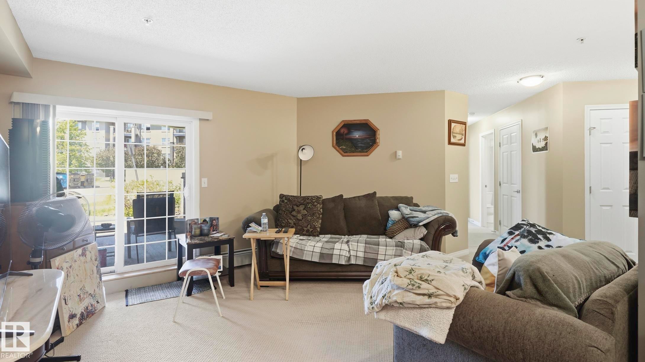 #103 630 Mcallister Lo Sw, Edmonton, AB - Indoor Photo Showing Living Room