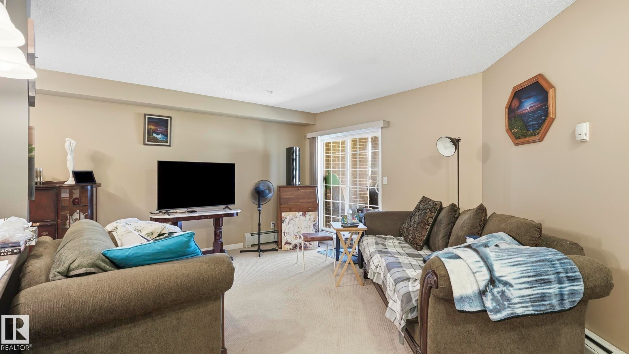 #103 630 Mcallister Lo Sw, Edmonton, AB - Indoor Photo Showing Living Room
