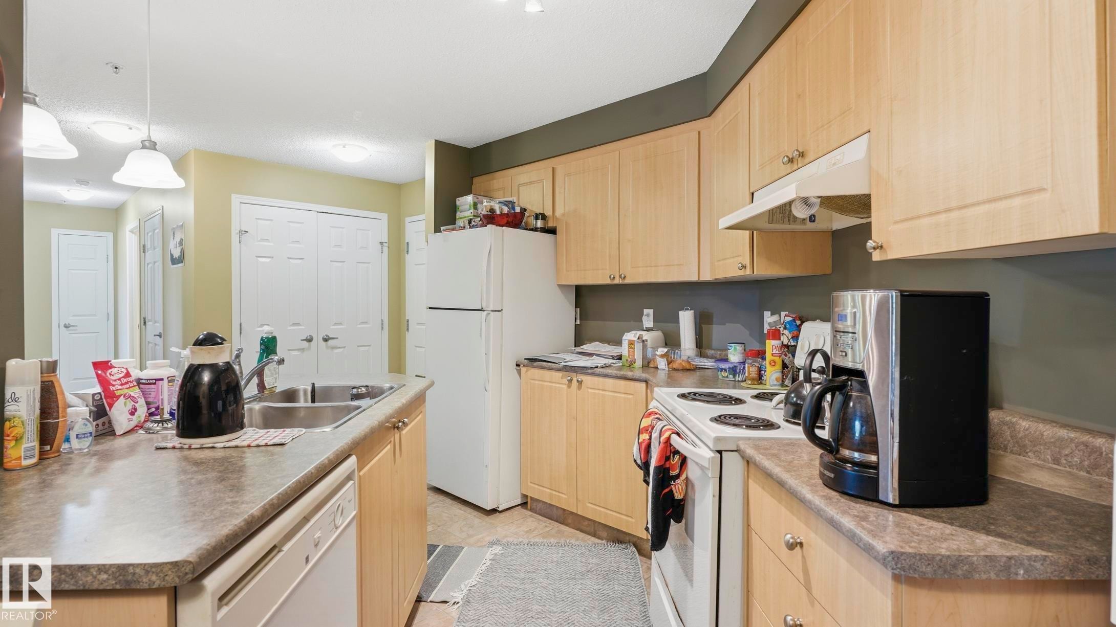 #103 630 Mcallister Lo Sw, Edmonton, AB - Indoor Photo Showing Kitchen With Double Sink