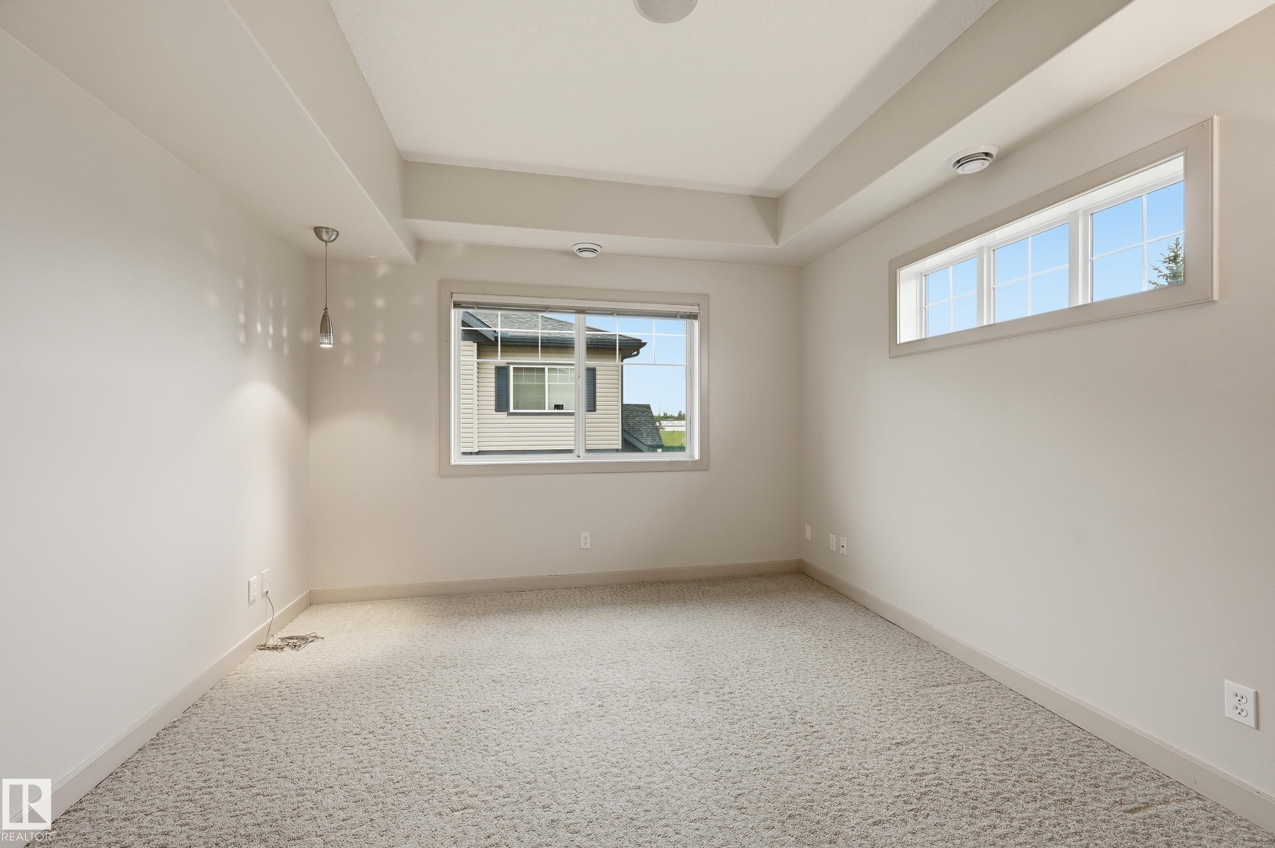 Tray ceiling featuring recessed lighting and a central ceiling speaker - 50 2565 Hanna Crescent, Edmonton, AB