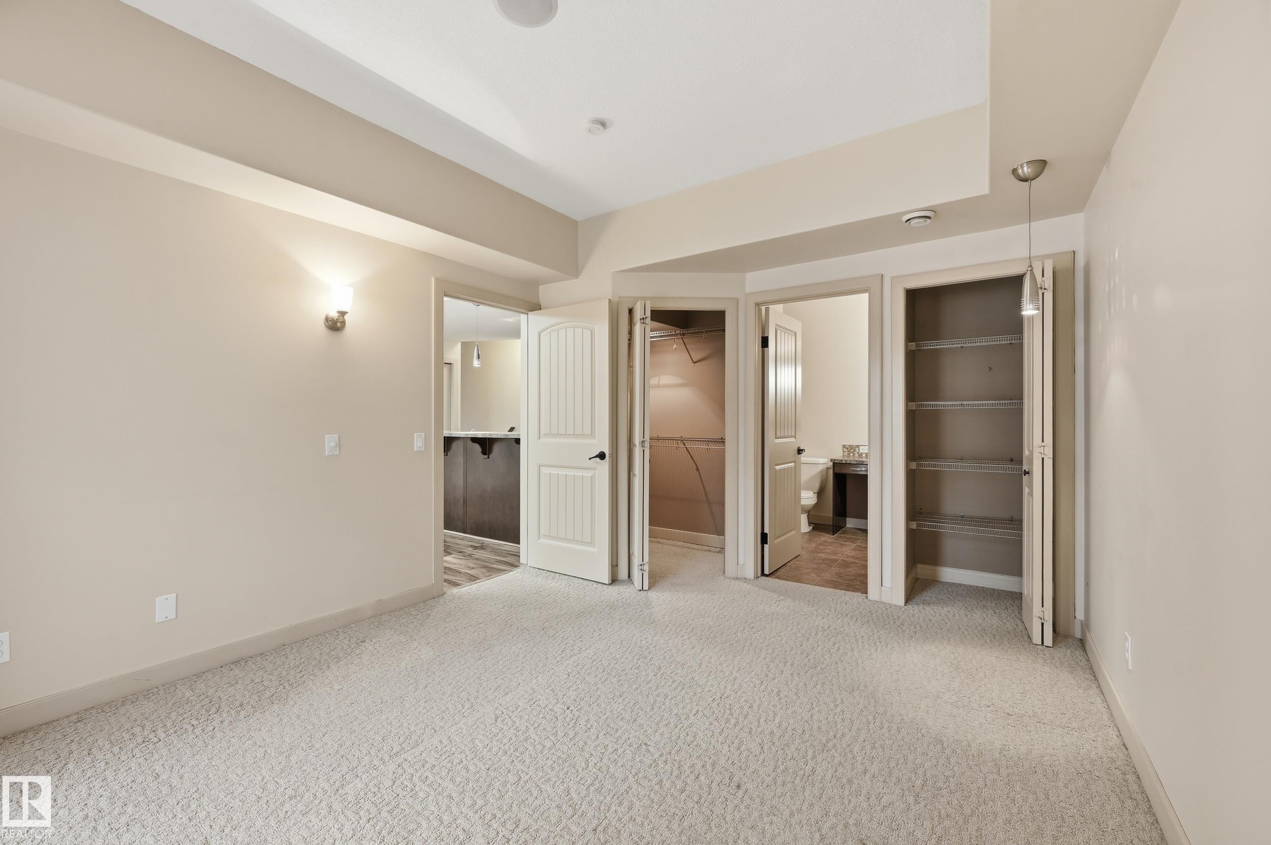 Carpeted room with recessed lighting and neutral wall tones - 50 2565 Hanna Crescent, Edmonton, AB
