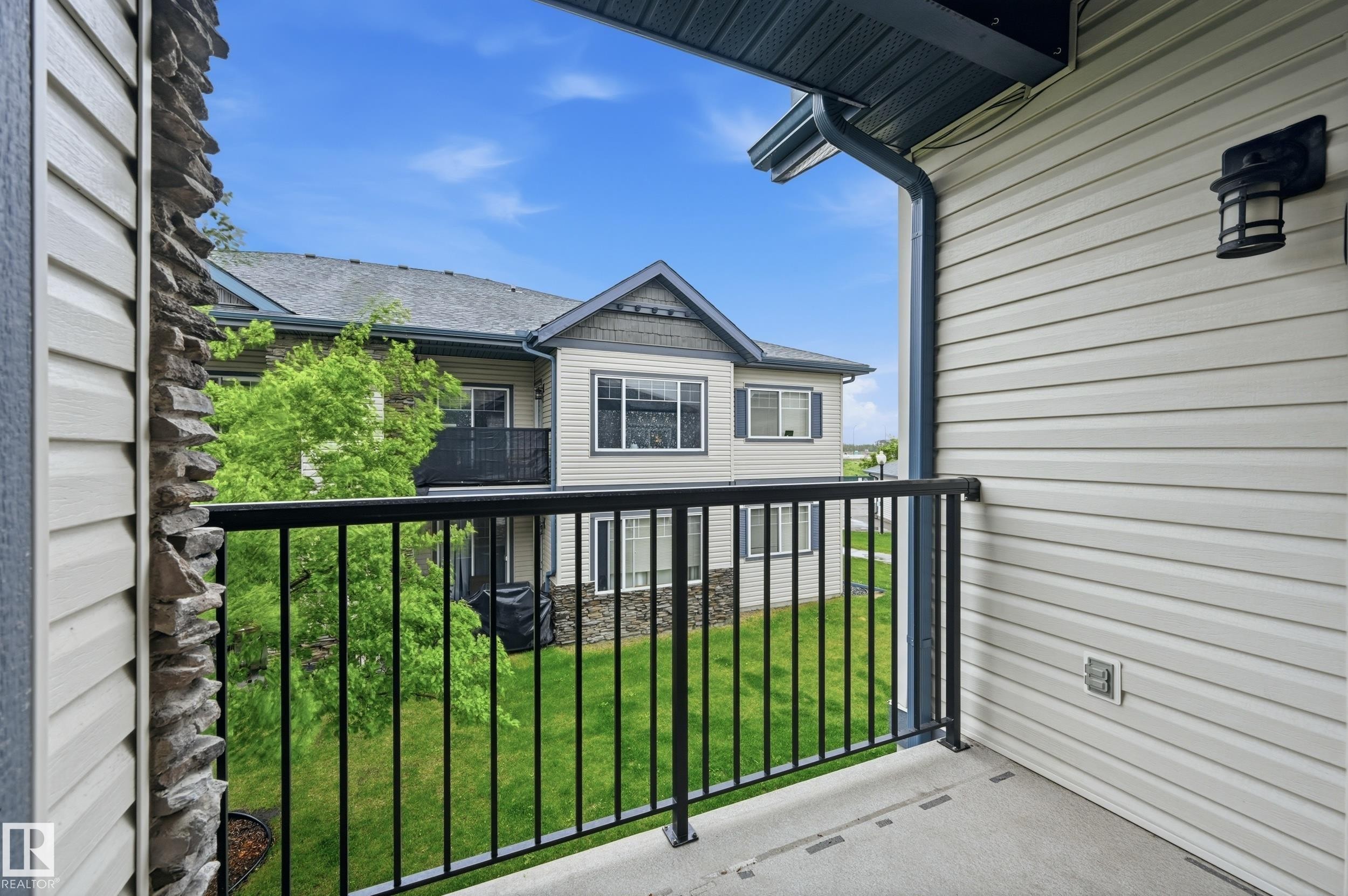 Private balcony featuring a black metal railing and concrete flooring - 50 2565 Hanna Crescent, Edmonton, AB